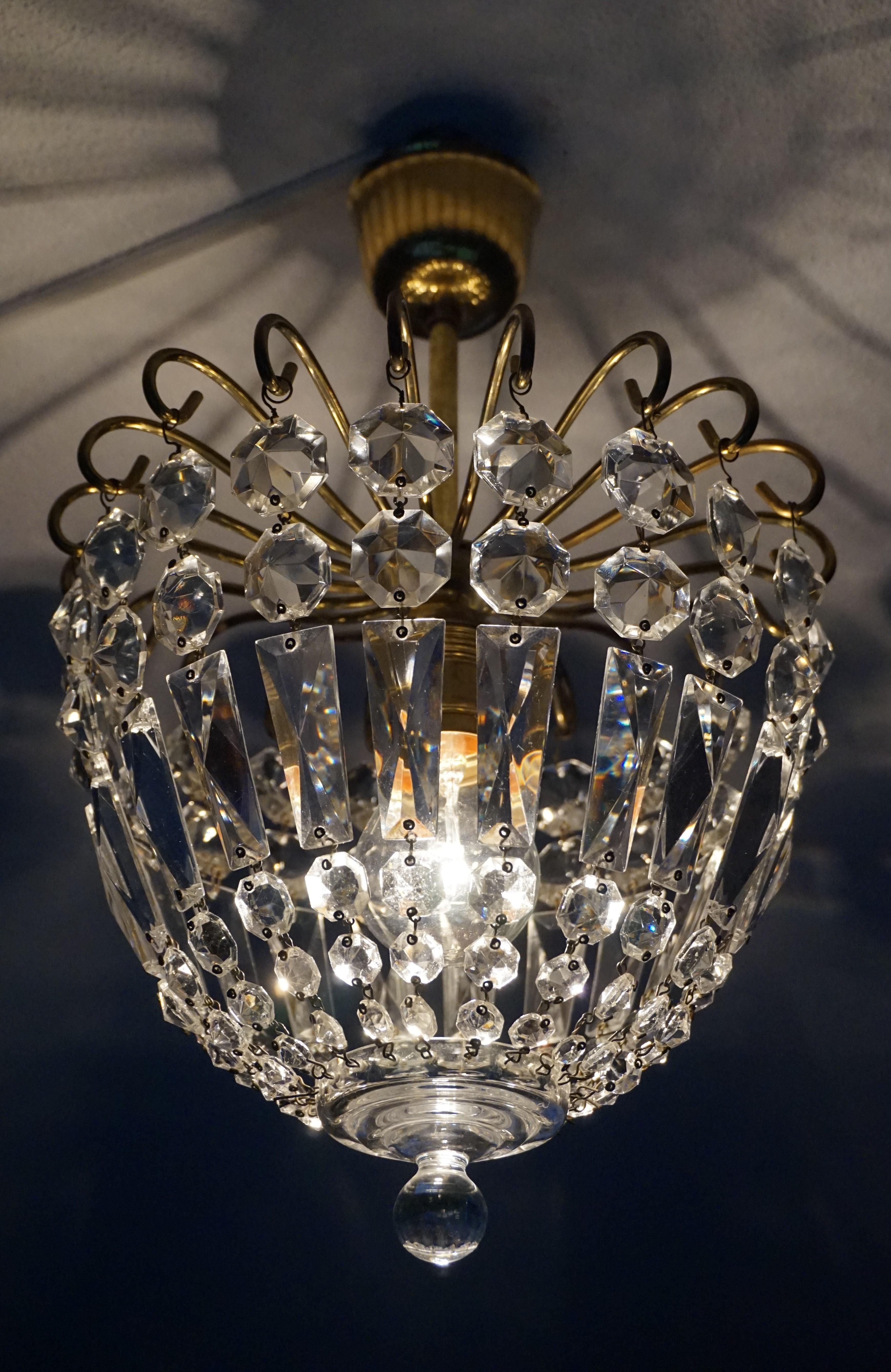 Beautiful and excellent condition, 1950s pendant.

If you are looking for a small size, but elegant and well made pendant to grace your hallway, landing or bedroom then this mid-century light fixture could be perfect for you. Both with the light