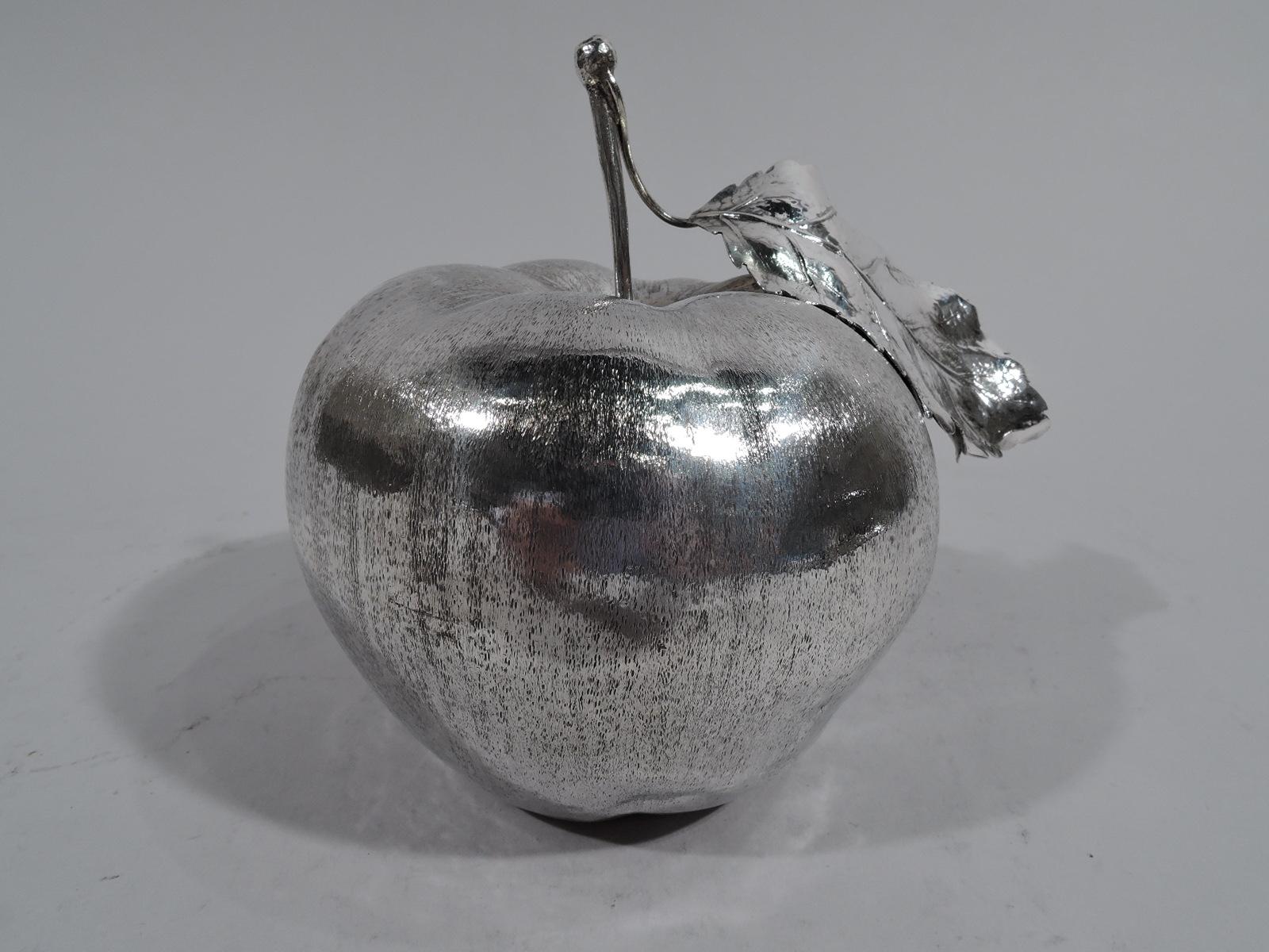 Stylish sterling silver lighter. Made by Mario Buccellati in Milan. Large apple with naturalistic irregular form and striated skin. Long stem with leaf. Detachable lighter set in underside. Marked “925 / Mario Buccellati”. Weight (without lighter):