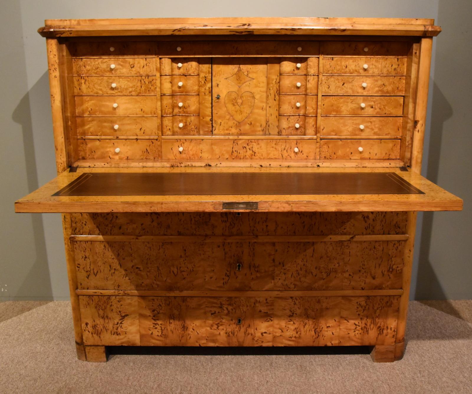 A stylish masur birch Biedermeier escritoire. A very stylish Swedish writing cabinet fitted interior and feather lined writing surface of Biedermeir period. 

Dimensions:
height 49.5