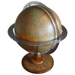 Élégant, de fabrication parisienne du milieu du 20e siècle, globe de bureau/de table terrestre avec lampe