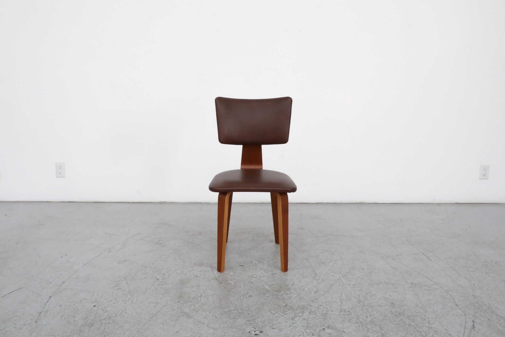Beautiful single Cor Alons dining chair with it's signature bent teak plywood frame, original brown skai (faux leather) upholstery and nail-head detail on the backrest. Cornelius Louis (Cor) Alons, interior designer, industrial designer and painter,