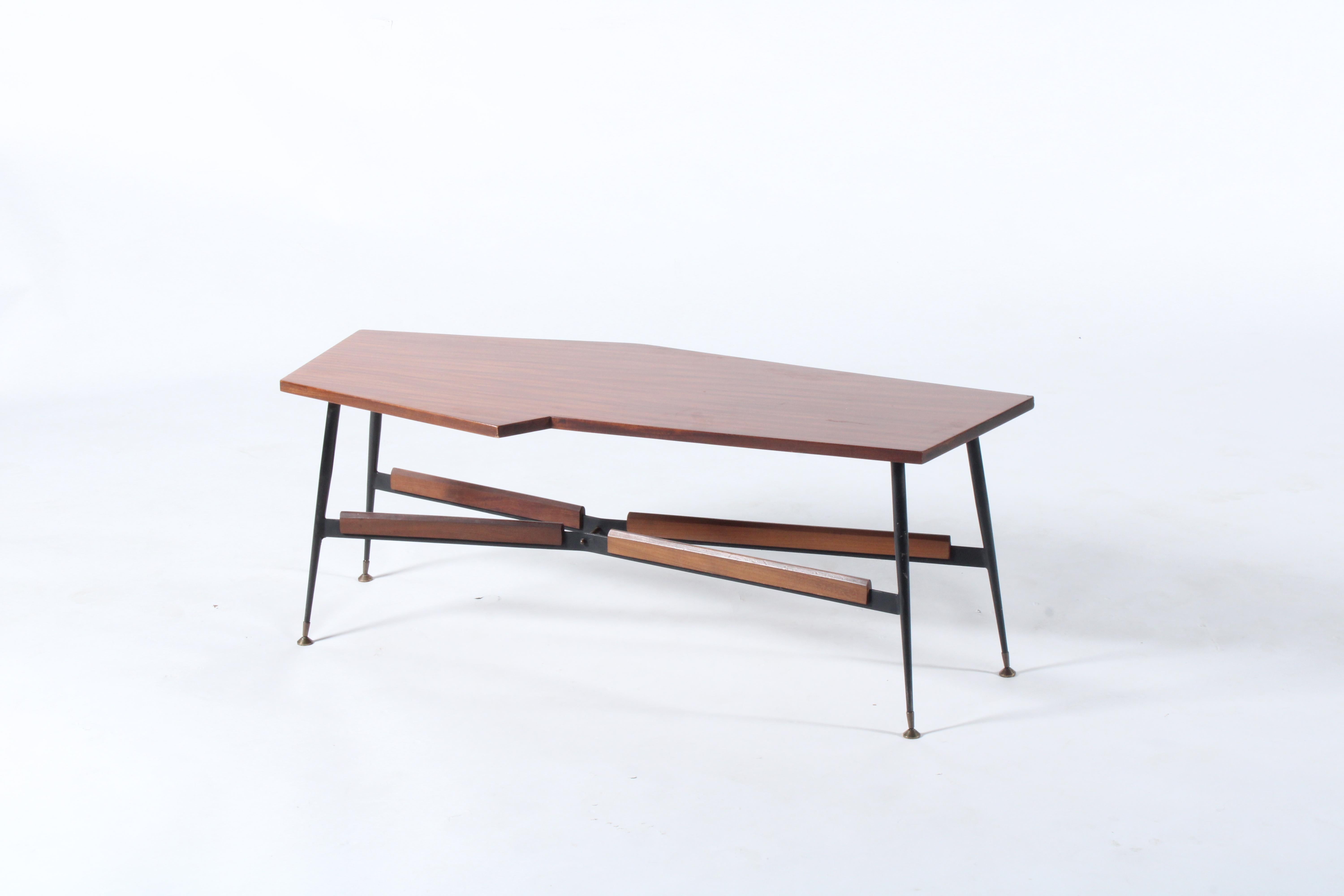 An unusual yet super stylish original mid century Italian coffee table. Dating from the 1950’s and sourced in Turin from a private collector this piece is presented in excellent untouched original vintage condition. The angular polished mahogany top