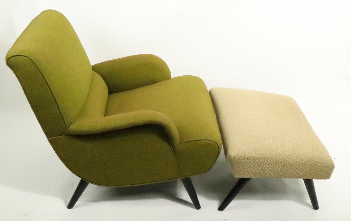 Stylish mid century chair and matching ottoman, structurally sound and sturdy, upholstery shows wear. Sensuous and seductive lines, well crafted construction, chic and comfortable.
Dimensions of chair:
Total H 29.25 x arm H 19 x seat H 15.75 x W 29