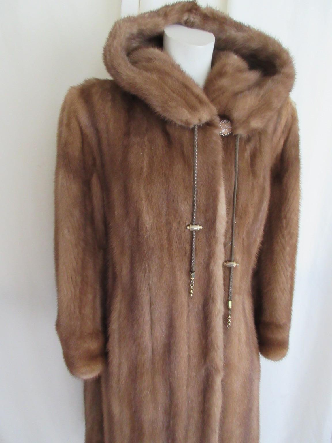 Stylish mink fur coat with attached hood 

Rare to find

We offer more exclusive lambskin and fur items, view our frontstore.

Details:
Side splits 2 tassels, fully lined
With 2 pockets, 3 closing hooks, 1 collar button 
Fully lined
Attached hood