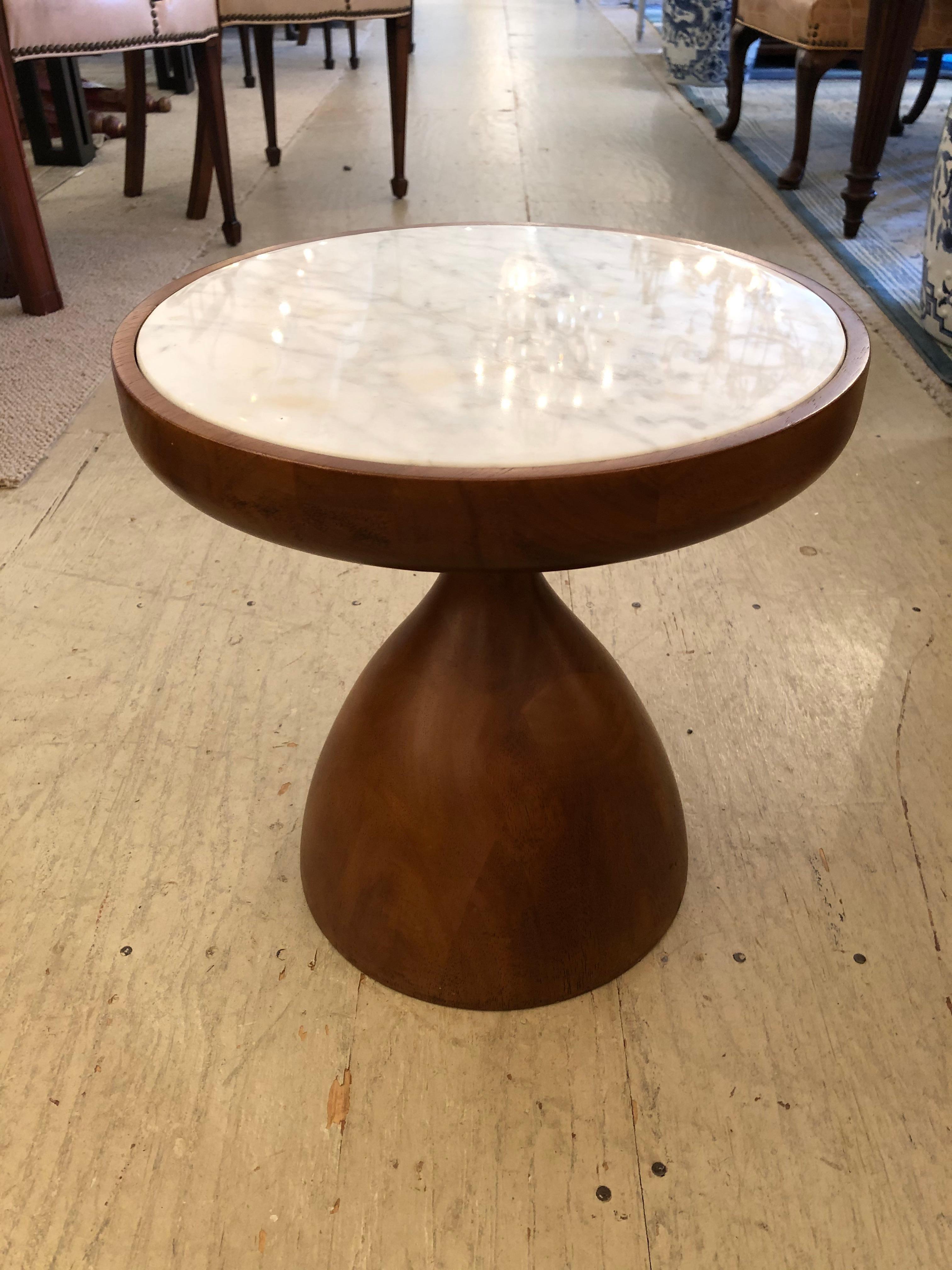 Stylishly mod mushroom shaped Jonathan Adler drinks table having walnut sculpted base and round white marble top.