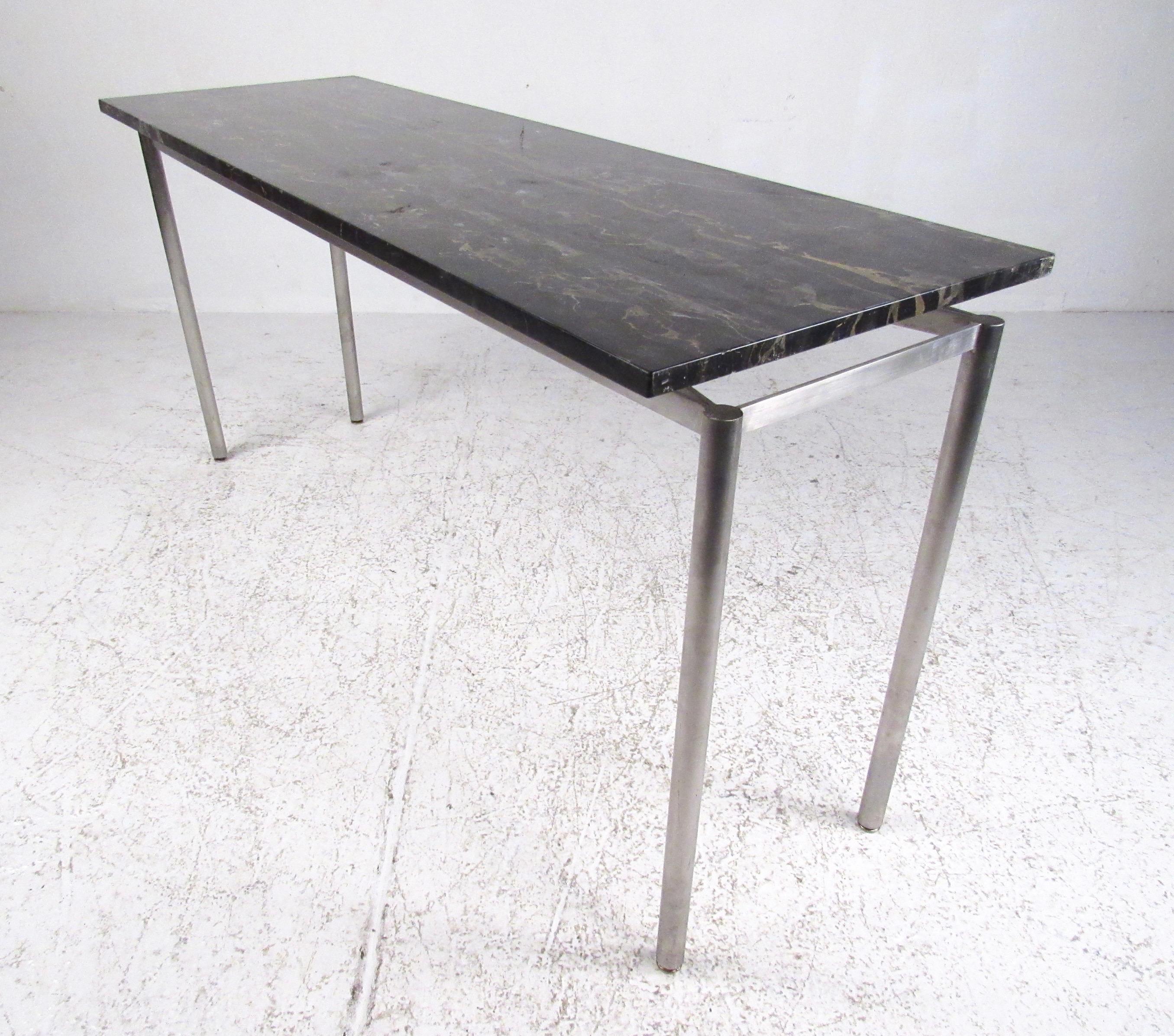 Impressive contemporary modern console features floating marble top with unique metal finish frame. Perfect height for sofa or hall table, this piece makes an elegant modern statement in home or office setting. Please confirm item location (NY or