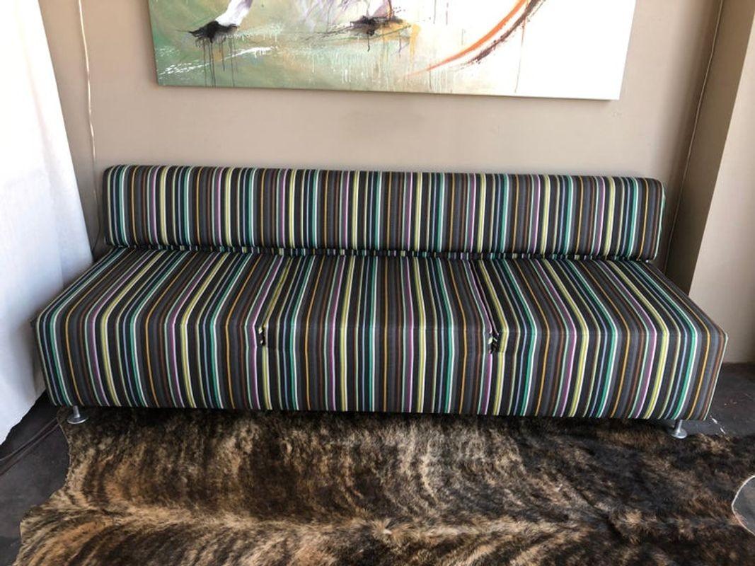Low back sofa couch with stripes.