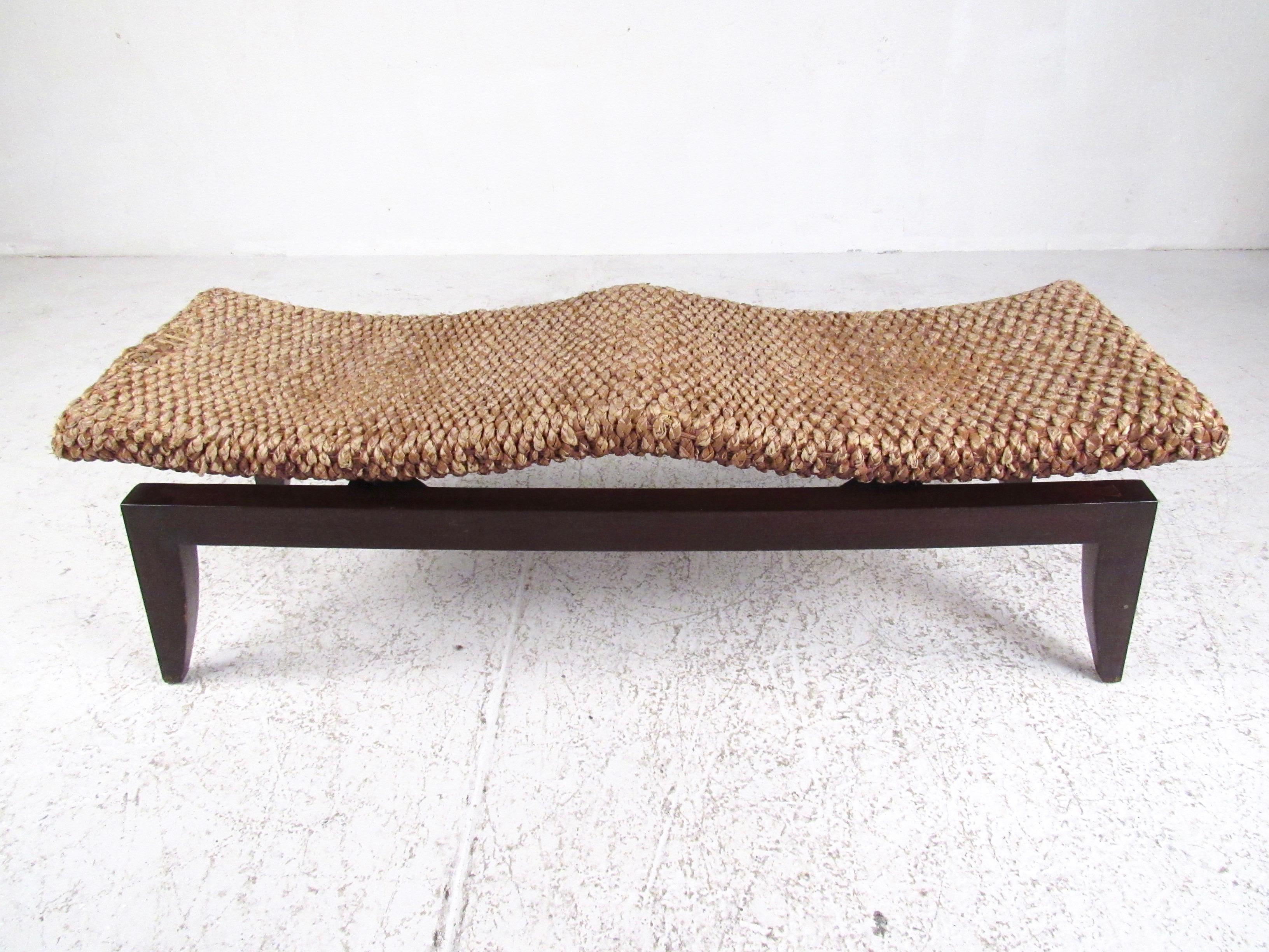 This unique modern bench features woven seagrass style seating with tapered wood base. Two seat design makes a comfortable and stylish statement piece for occasional seating at home or the office. Please confirm item location (NY or NJ).