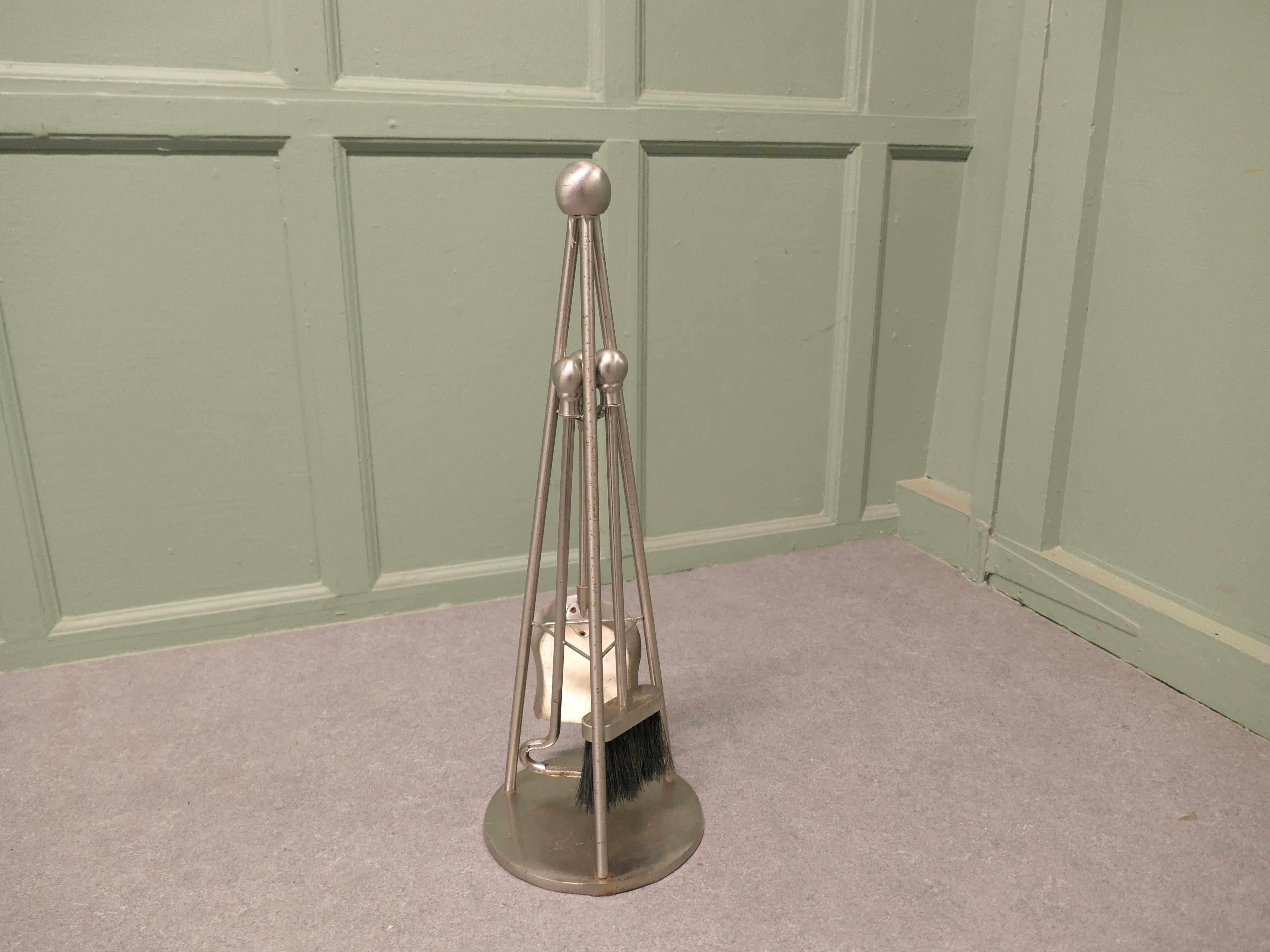 Stylish Modernist Steel Fireside Companion Set, Fireside Tools

This is a steel set on its own very sturdy triangular stand, shovel, brush and poker  
The stand 26” tall and 9” in diameter
TAH180
