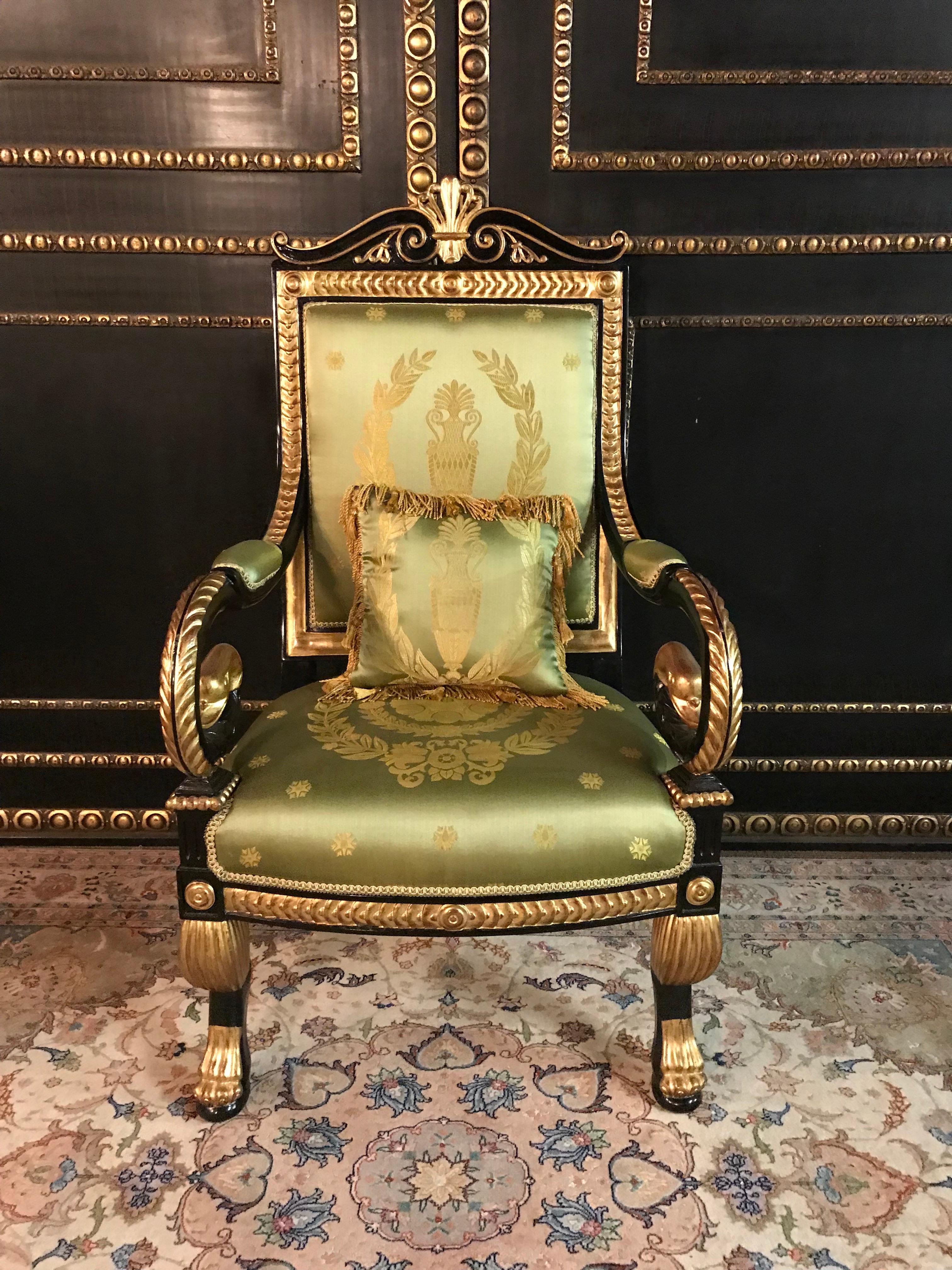 Napoleonic Splendor Swan armchair Empire style armchair
Exactly fine carved sculpting work from solid, blackened beech wood. Gilded gesso. Curved frame ending on plastically carved legs in claw feet. Armrests curved like a volute into a swan's head.