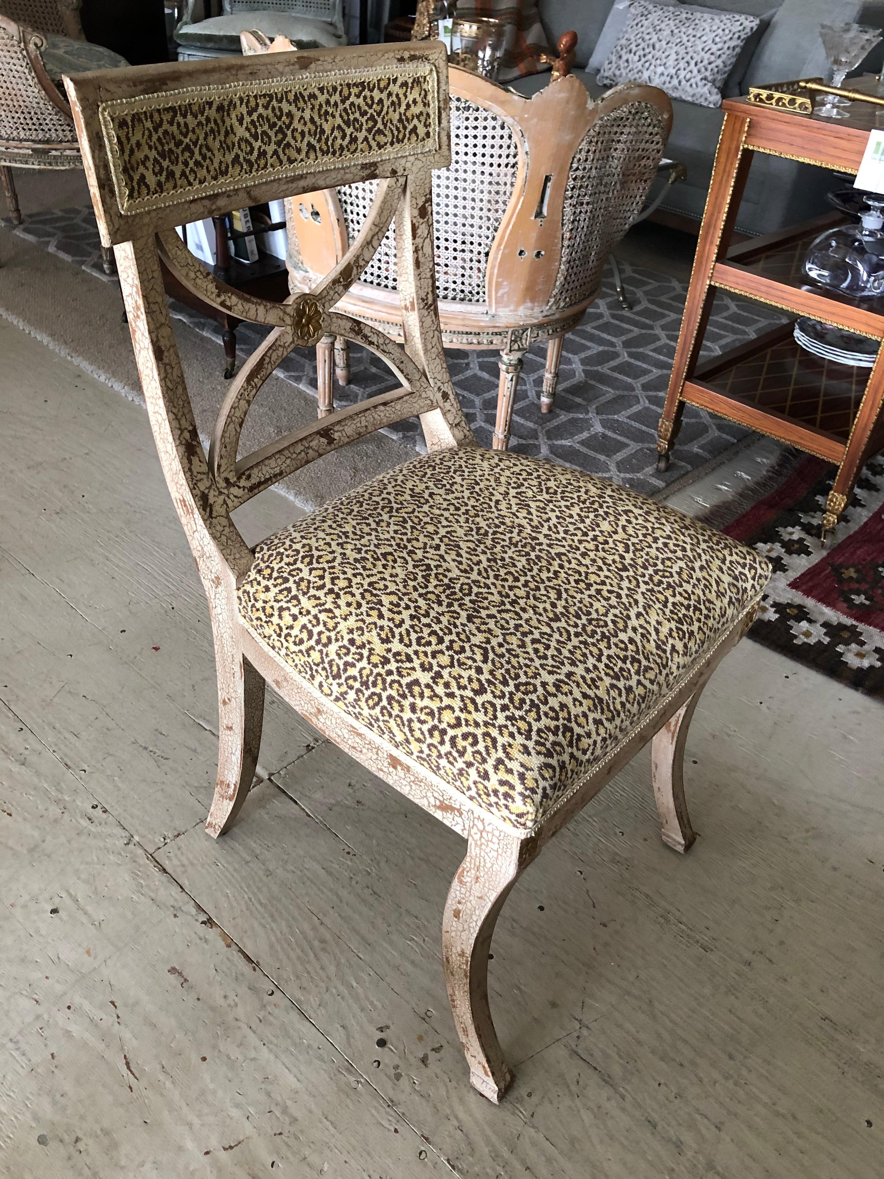 Stylish crackle finish cream painted French style side chair having gilded details and fabulous faux leopard upholstery. Would make a glam desk chair.