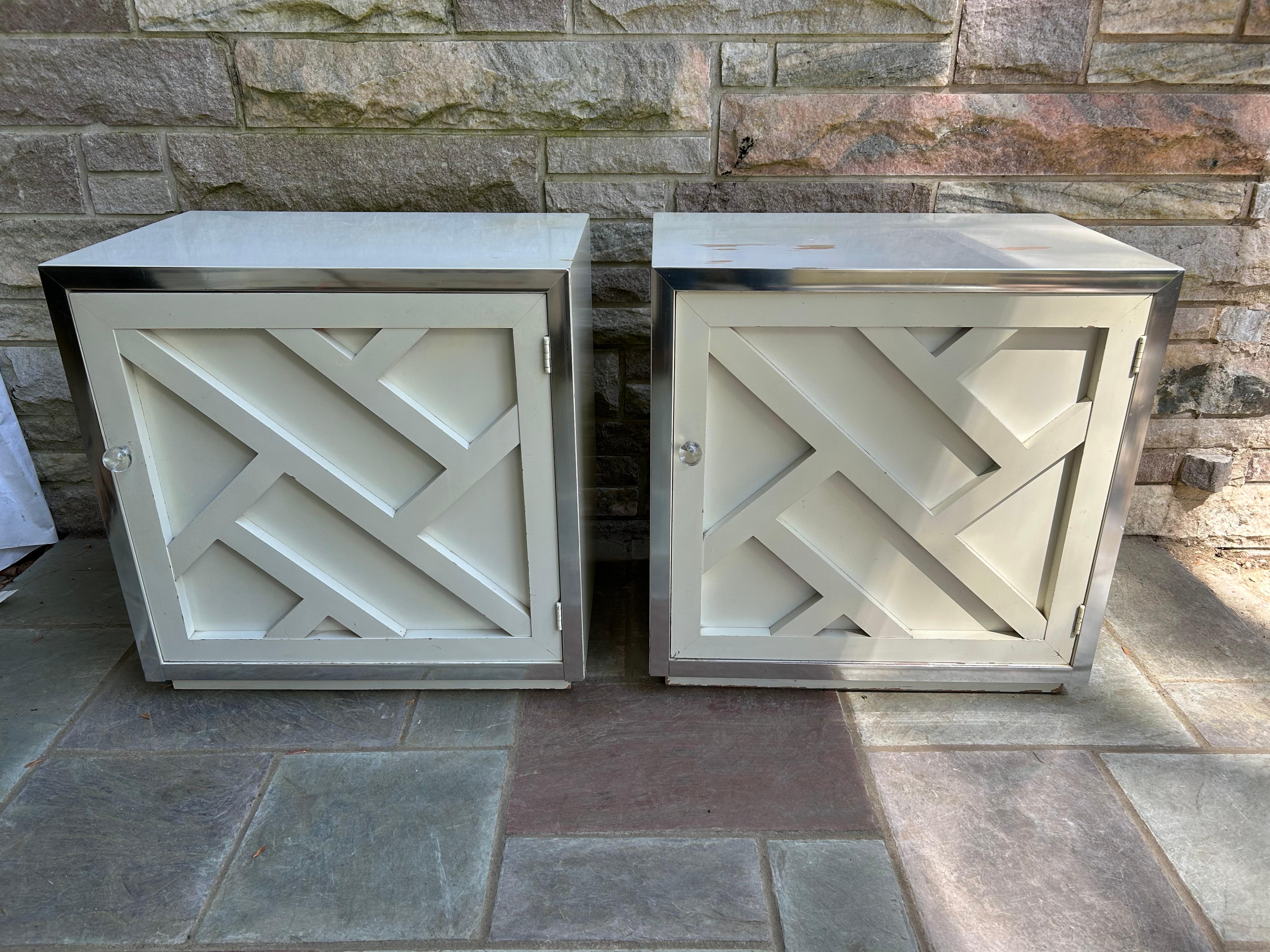 Stylish pair of Milo Baughman style lattice front and chrome night stands.  We love the bold lattice design on the doors against the chrome frame accented perfectly with a lucite ball pulls.  Yes, these will need to be re-lacquered but think of the