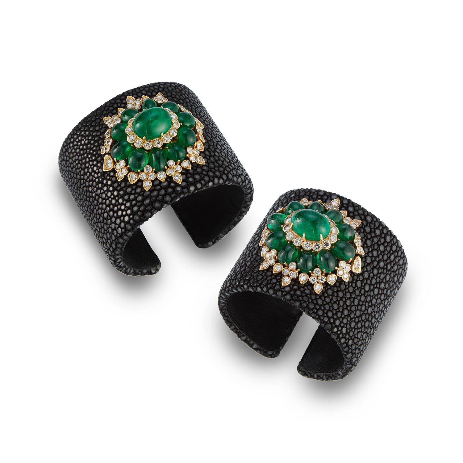 A very stylish pair of cabochon emerald and diamond bangles

Approximately 8 carats of diamonds
Approximately 90 carats of fine gem cabochon emeralds 

Mounted in yellow gold on shagreen