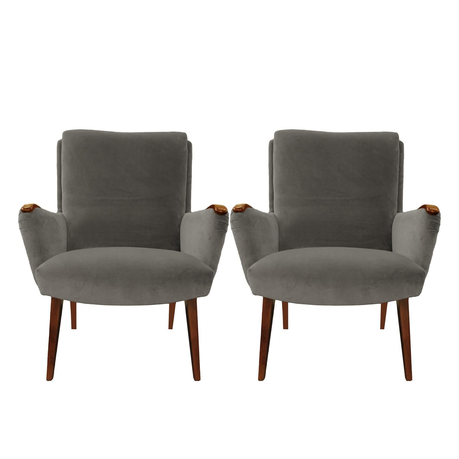 Pair of stylish, petite lounge chairs with wallnut arm pads and legs. Recently covered in gray Holly Hunt high performance velvet. Italian, 1950s.