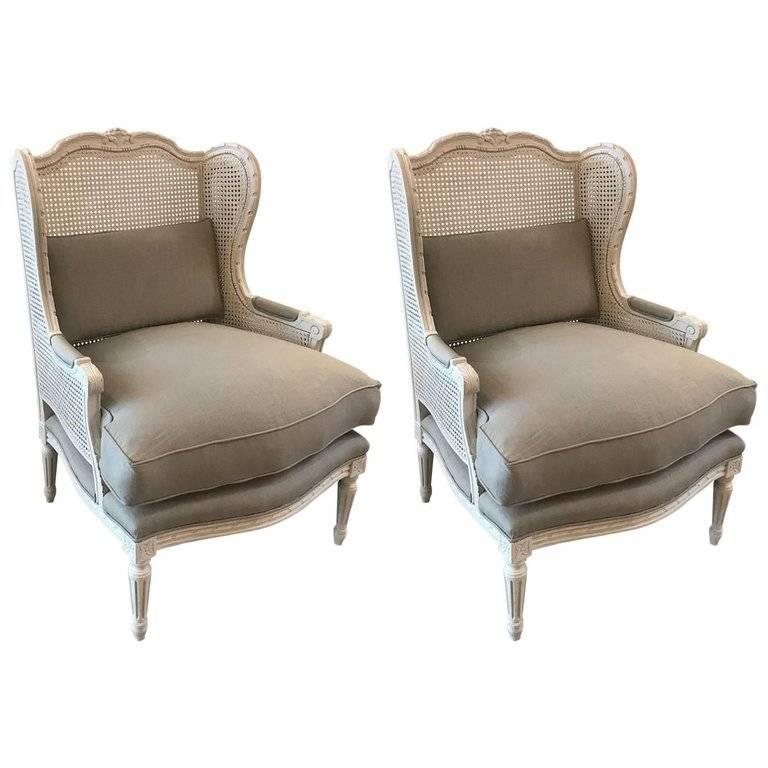 Stylish Pair of Louis XVI Style Painted Walnut and Cane Wing Chairs
