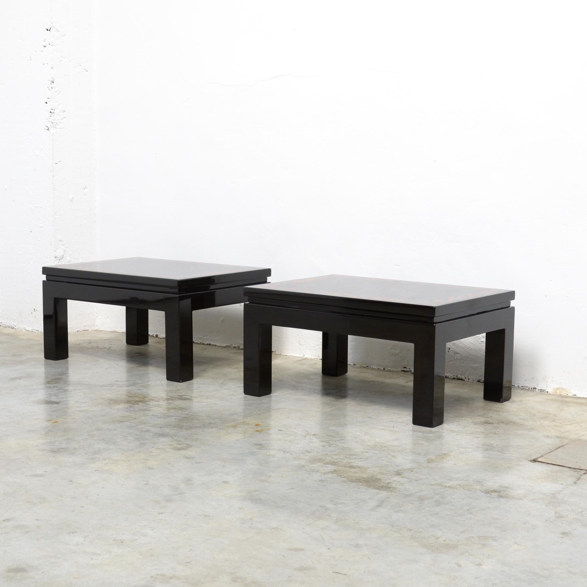 This stylish pair of side tables was designed and created in the Atelier of Marcel and Jean Claude Dresse. They can be dated in the 1970s.
The tables are made of glossy black lacquered resin on wood, with faux tordoise shell inlay.
The tables are