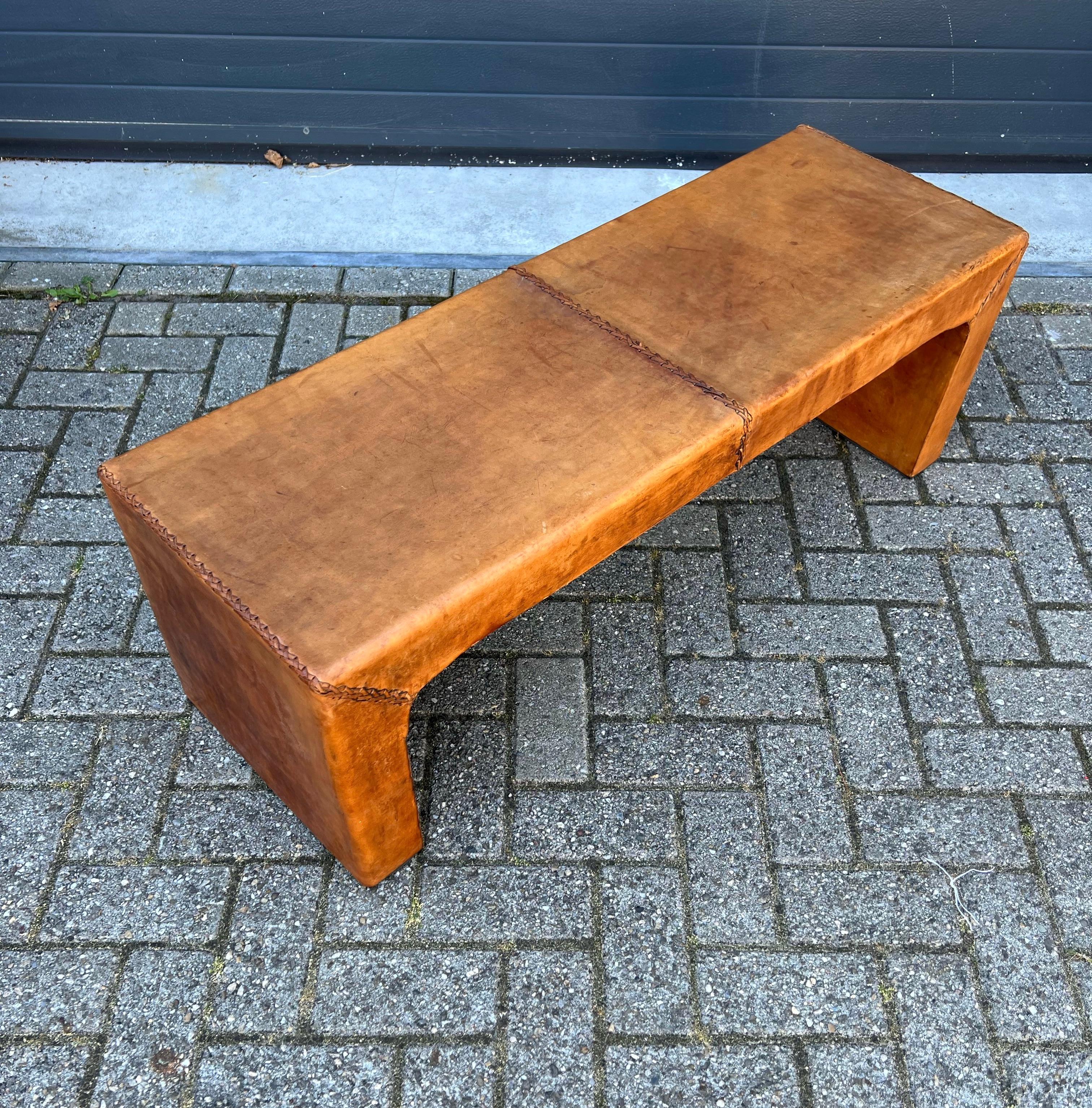 Wonderful design and condition, 1960s hand-crafted leather bench.

This perfectly symmetrical and straight lined bench is in amazingly good condition and it is as stabile as the day it was handmade. This hand woven with leather lace long seat, can