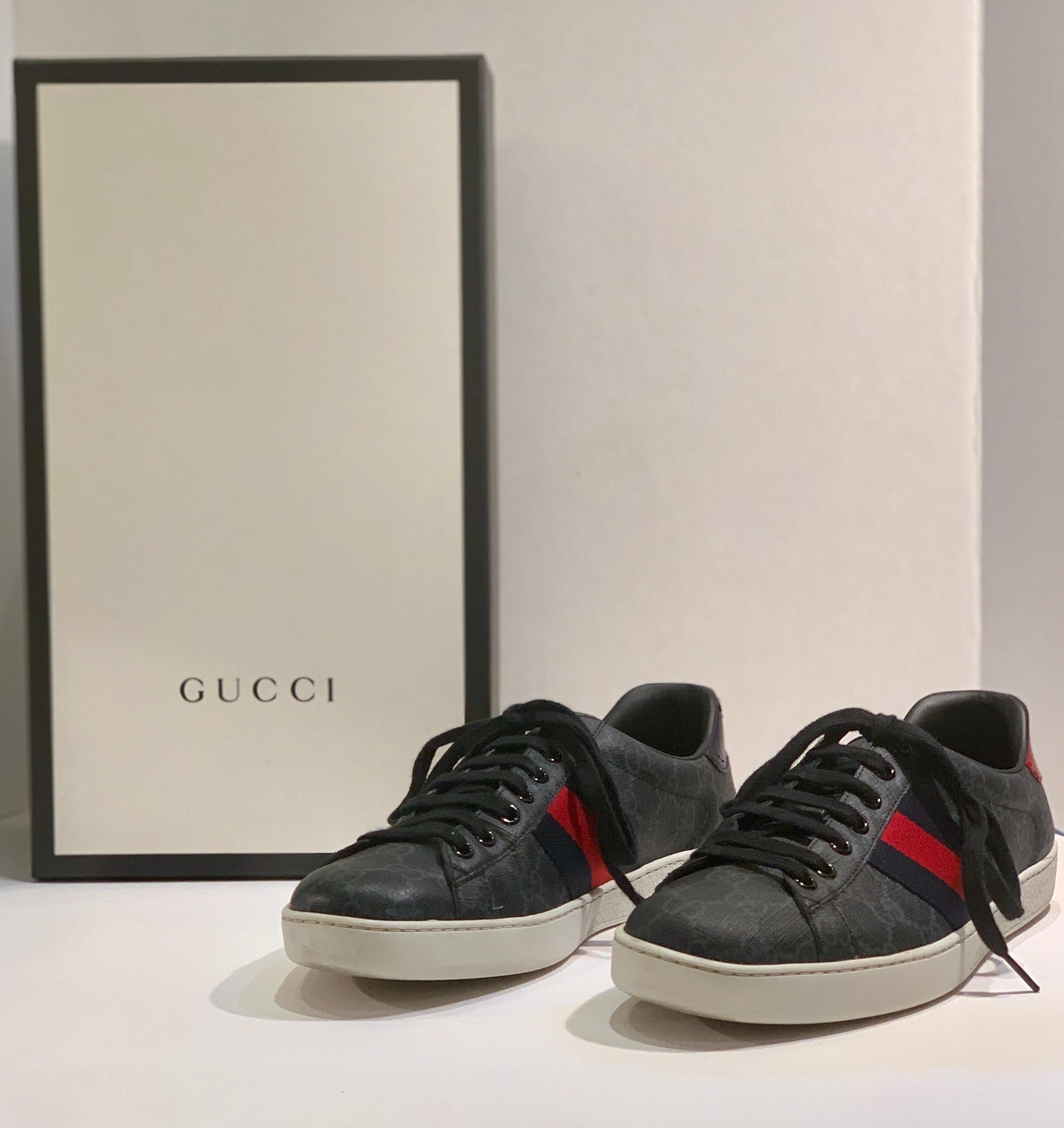 GUCCI Ace GG Supreme Sneakers are a men's size 7 or a women's size 9 shoe, described on the GUCCI website as, “The retro inspired design of the Ace sneaker is crafted in GG Supreme canvas in black and grey. First used in the 1970s, the GG logo was