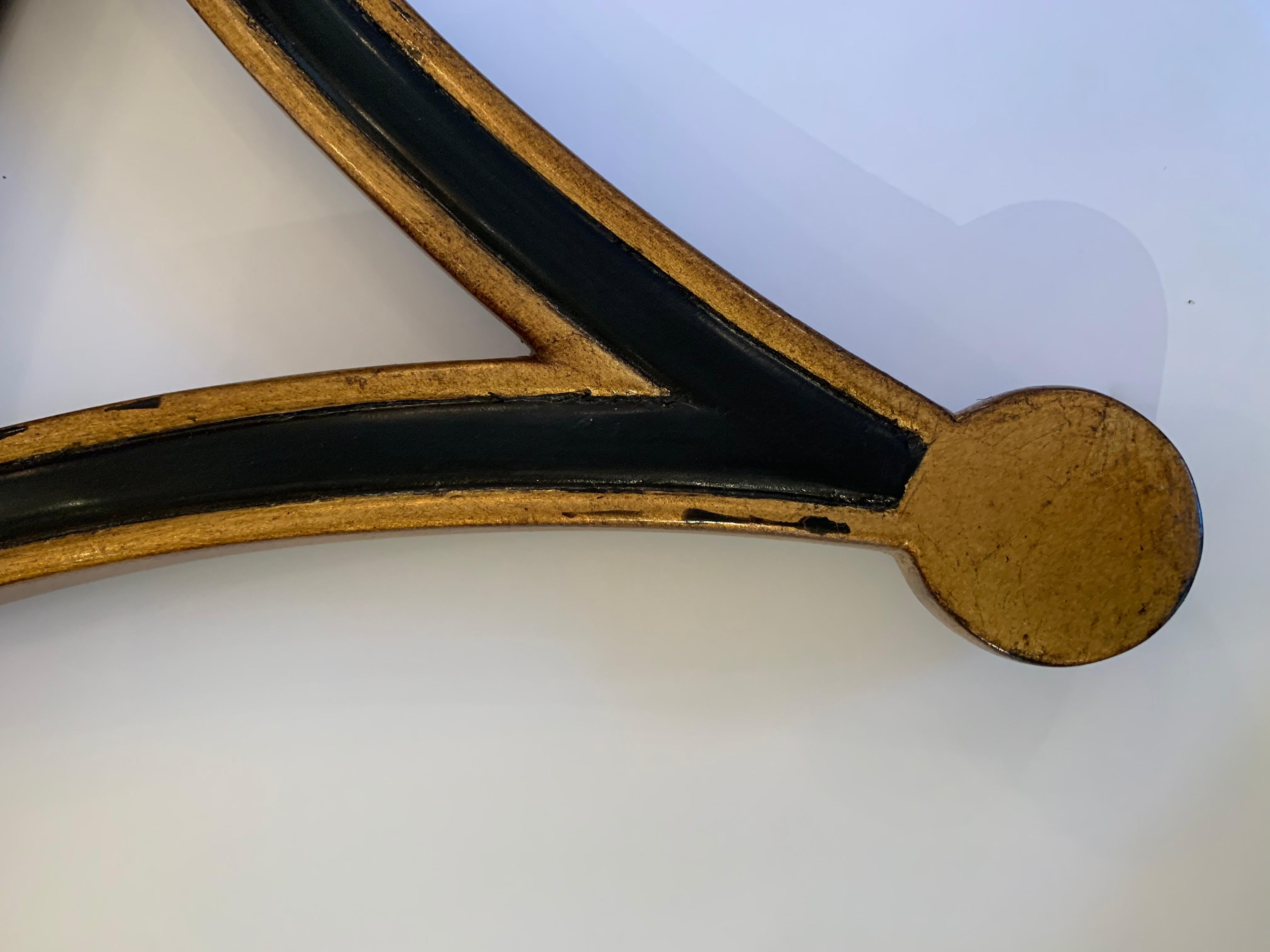 Neoclassical Stylish Round Starburst Mirror in Black and Gold by Theodore Alexander