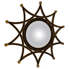 Stylish Round Starburst Mirror in Black and Gold by Theodore Alexander