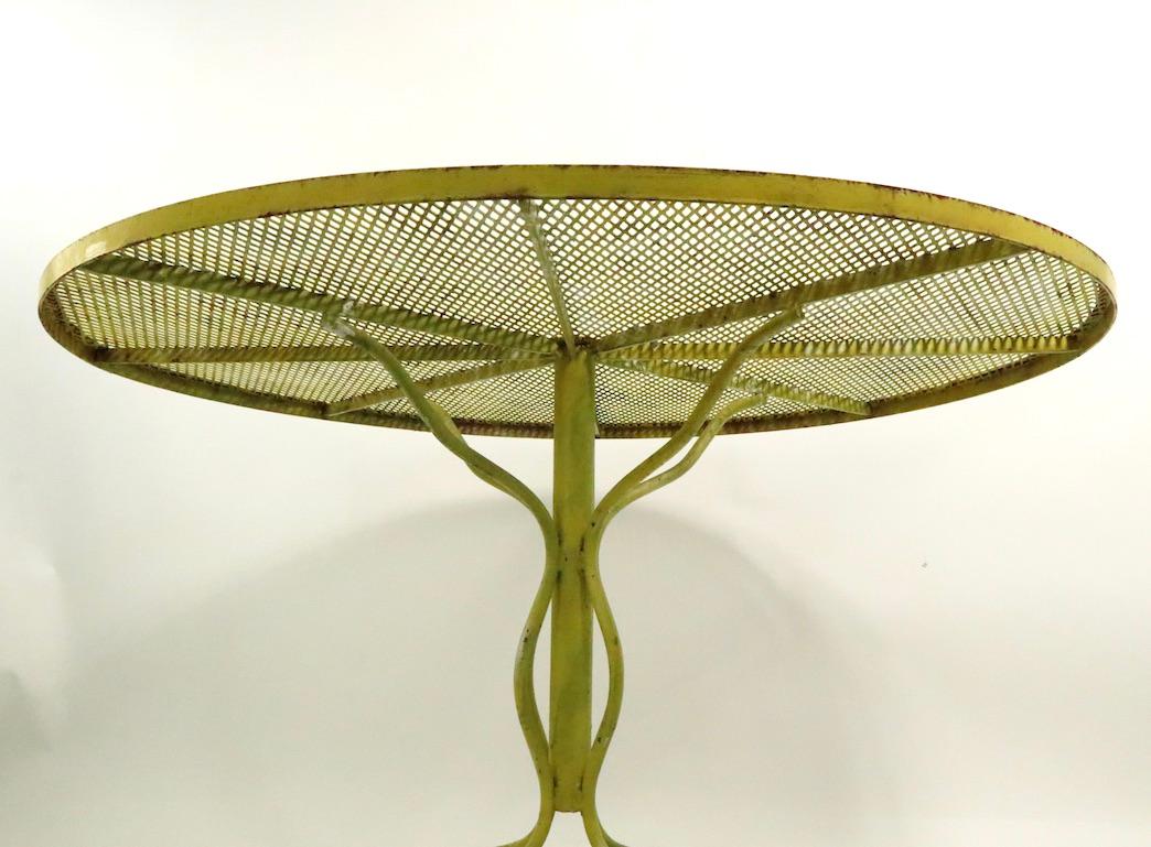 Stylish Round Wrought Iron and Metal Mesh Garden Patio Table by Woodard In Good Condition In New York, NY
