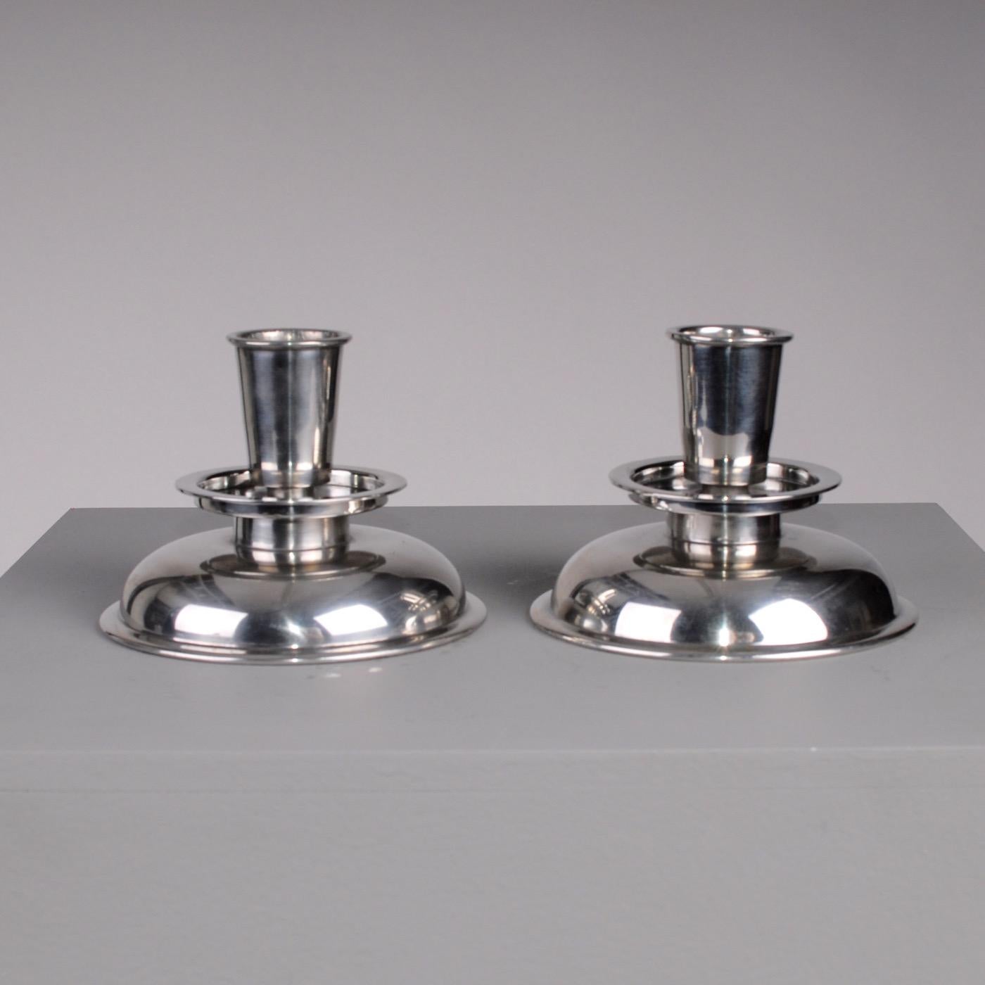 Nicely sized Scandinavian Art Deco pewter candlesticks, circa 1930. Circular shaped polished massive pewter made for large candles. Markers mark under.