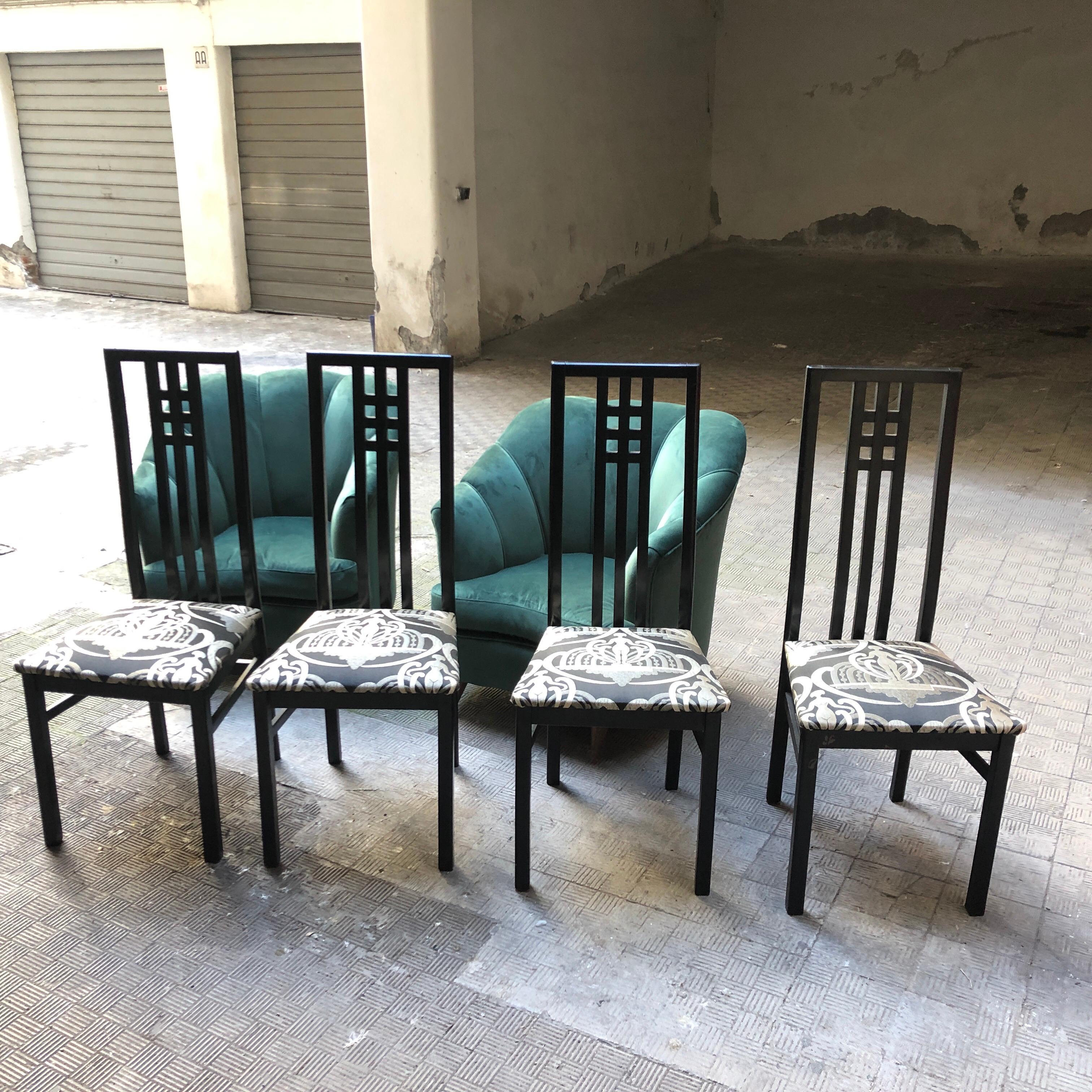 Four ebonized dining chairs, upholstered with a black and white Pierre Frey tissue. They are made in Italy in the 1970s.