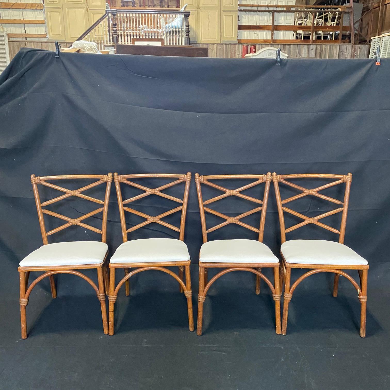 Rattan and maple vintage Heywood Wakefield Hollywood Regency style faux bamboo chairs with newly reupholstered seats. From the fabulous 1940s. Matching table is listed and sold separately.
seat height 17