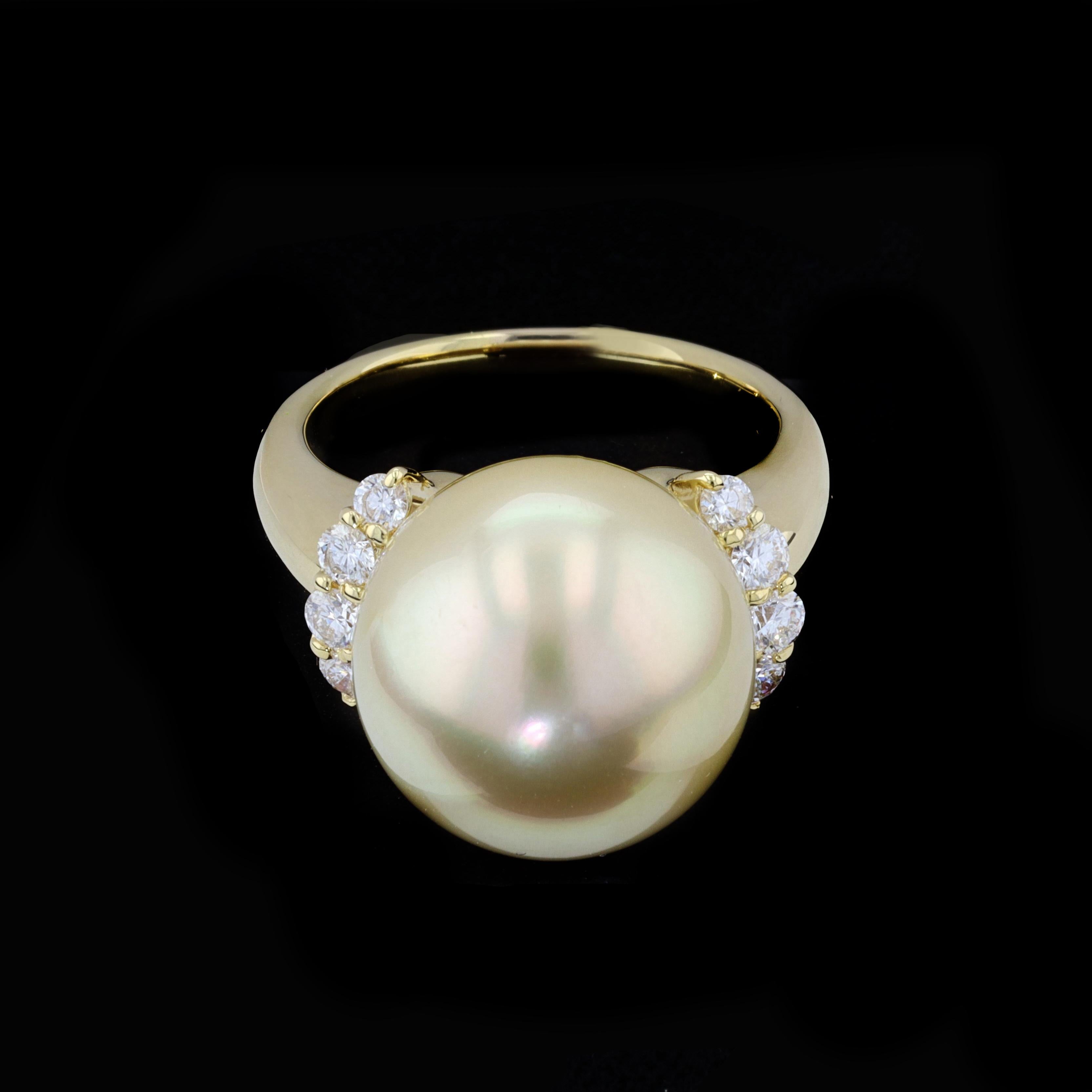 Dive deep and come up for air as this spectacular 18K Yellow Gold South Sea Pearl and Diamond Ring is certain to take your breath away. The ring is centered with a lovely south sea pearl that measures 15mm in diameter accentuated by sparkling round