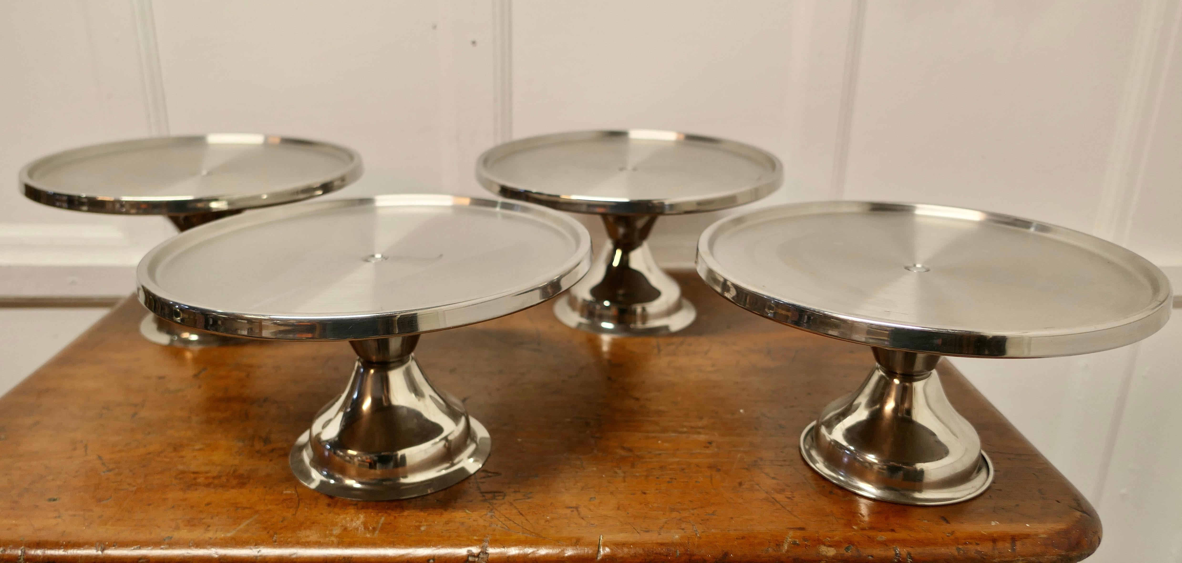 Stylish Stainless Steel Tazza Set of 4 Large Dishes

A  stylish mid century set with flat tops, standing on a circular base 

The Plates are 13”high and 7” in diameter
TSW50