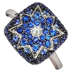 Élégante bague en or blanc avec saphir bleu étoilé et diamant blanc pour elle