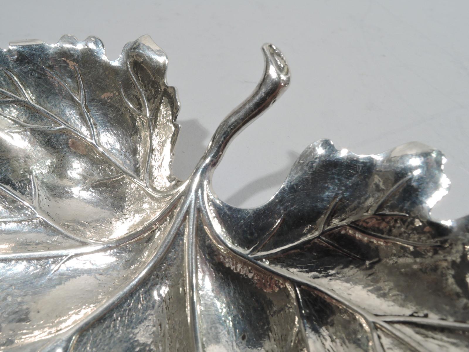 Stylish sterling silver leaf dish. Realistic with tooled ground, chased veins, irregular wispy tips, and stem. Fully marked with Gianmaria Bucellati and post-1967 Clementi di Giovanni Mantel stamps. Weight: 2.2 troy ounces.