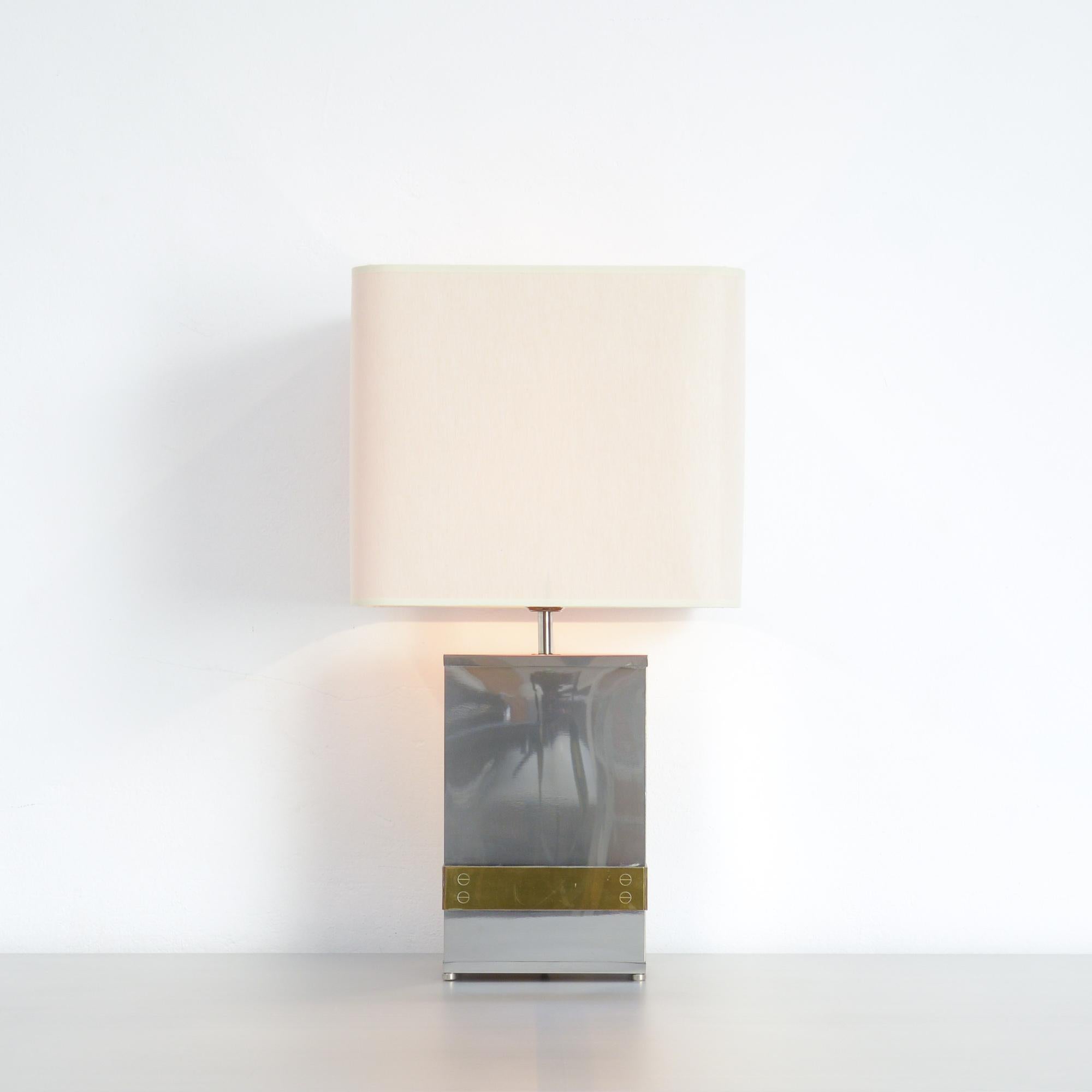 This stylish table lamp was designed by Tommaso Barbi in Italy in the 1970.
The base is made of polished stainless steel with brass details.
The lamp is in very good condition with a new lampshade. The lamp is marked.

 