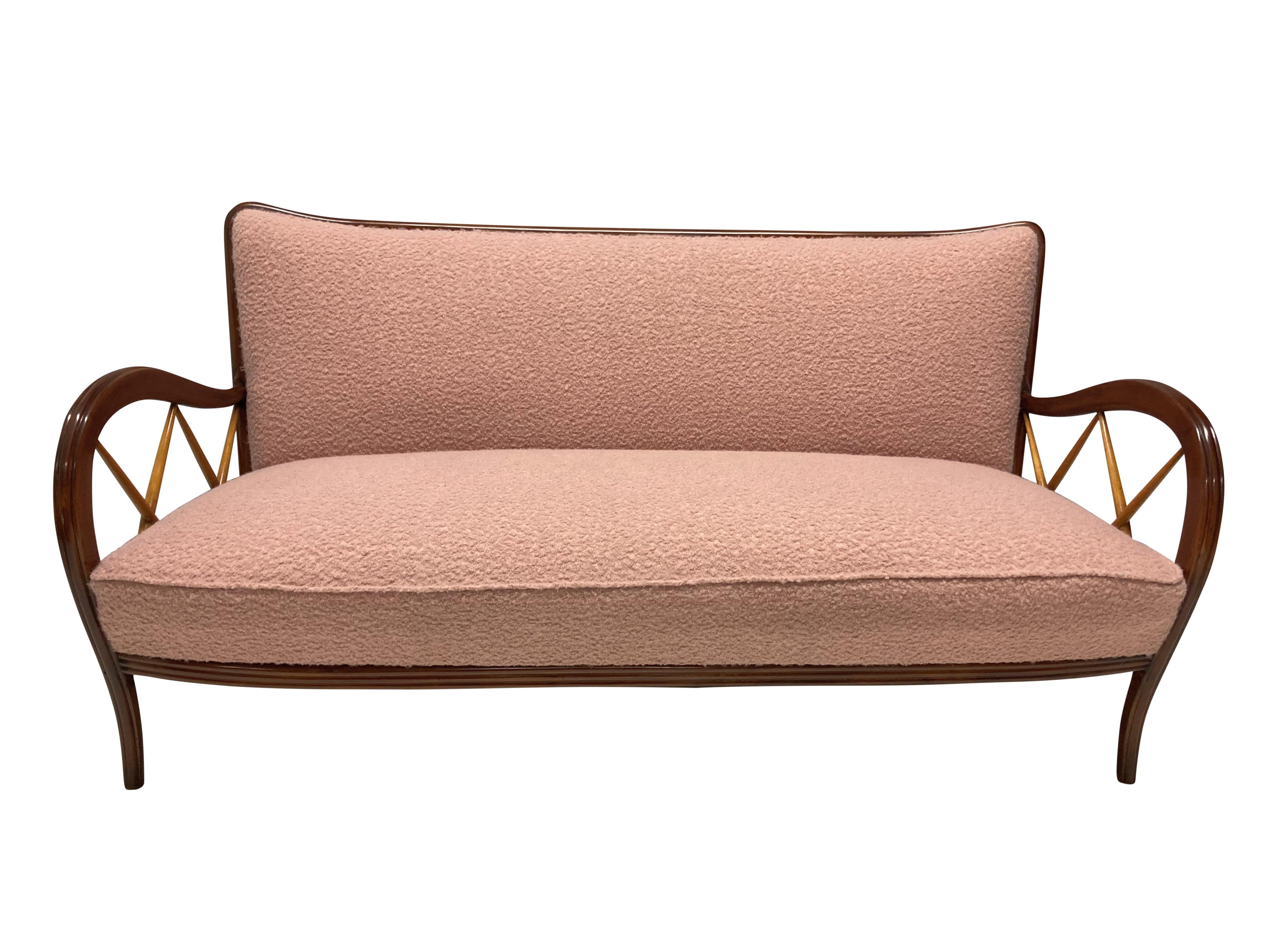 A stylish Italian sofa by Paolo Buffa. In walnut and blondwood and newly upholstered in dusty pink boucle. En suite with a matching pair of armchairs.