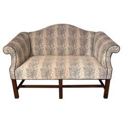 Stylish Upholstered Camelback Loveseat with Mahogany Legs