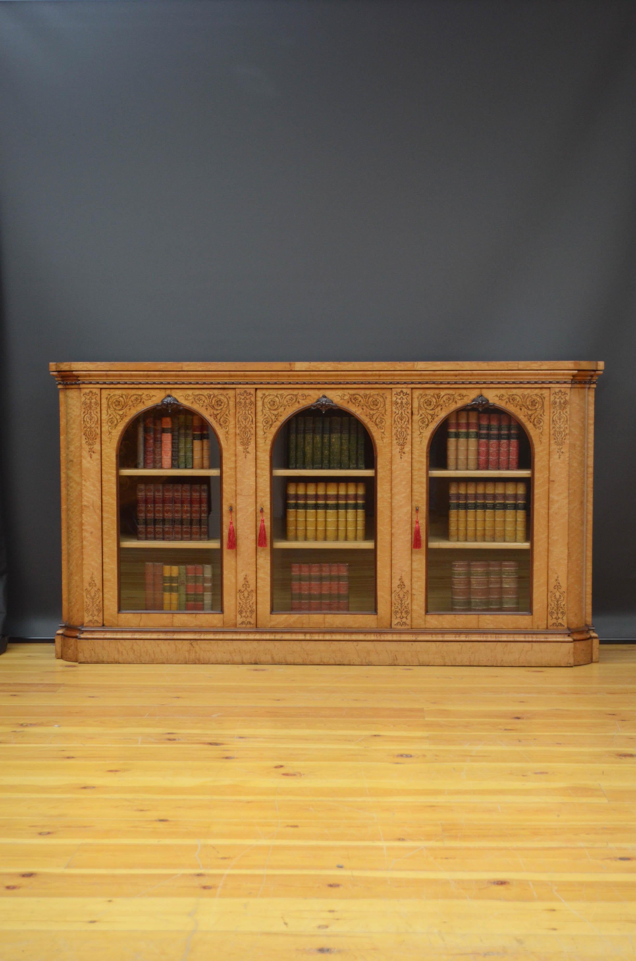 Sn5174 Fine quality Victorian bird's eye maple bookcase, having  oversailing top above beaded frieze and three glazed doors, all fitted with working locks and keys, and enclosing height adjustable shelves, decorated with floral inlays, all flanked