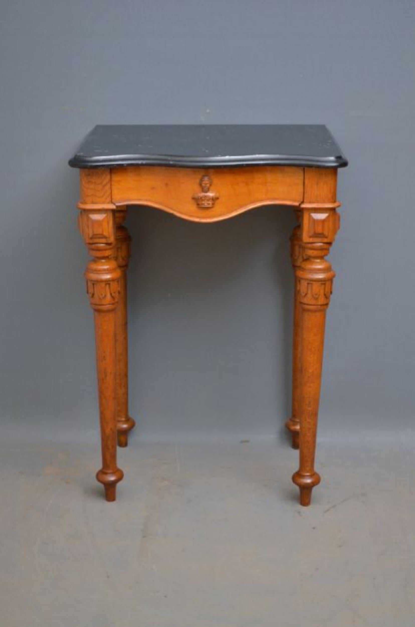 J00 Victorian, Gothic Revival oak hall table, having serpentine black veined marble top above frieze drawer, all standing on turned and carved tapered legs. This antique hall table is ready to place at home c1870
Measures: H 36