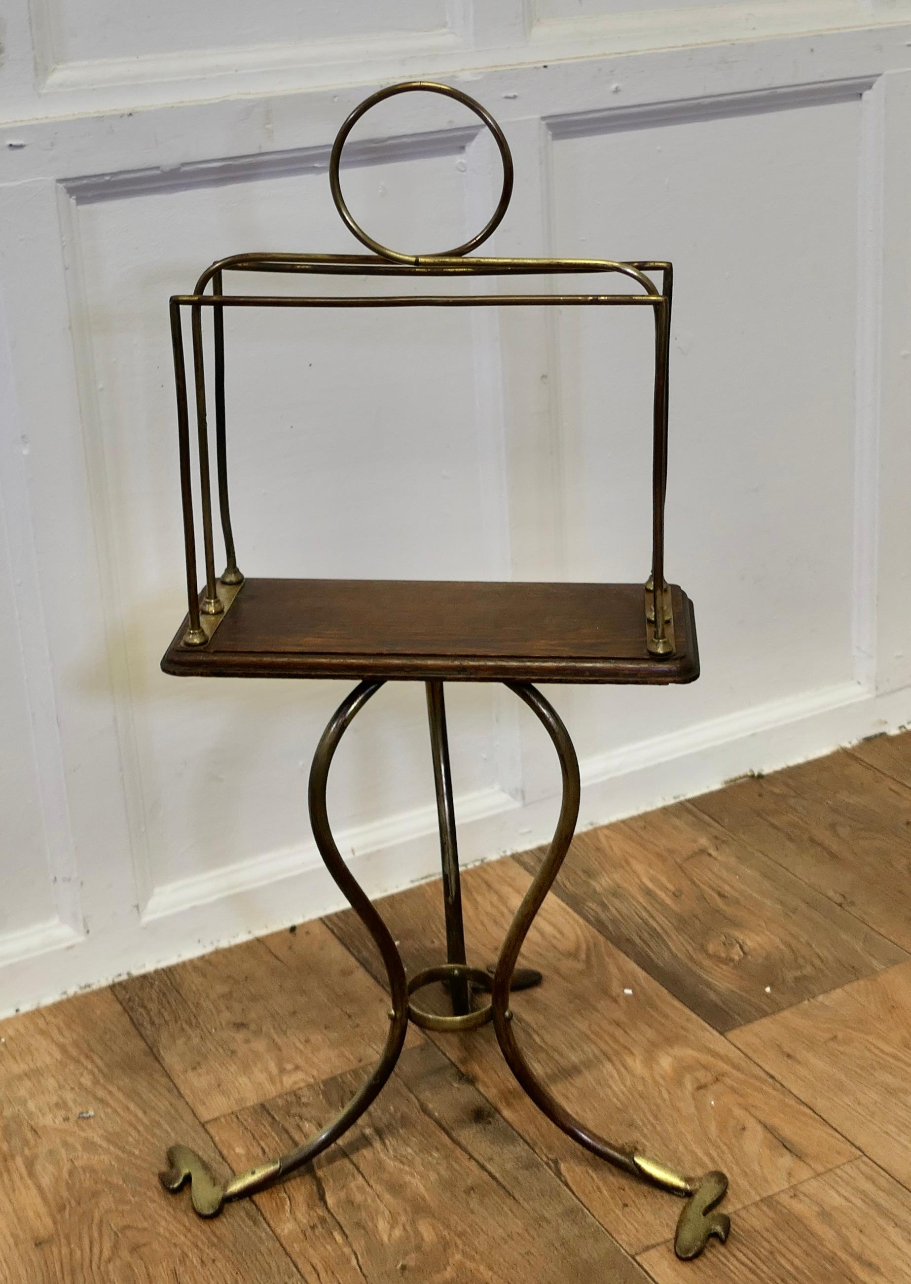 Stylish Victorian Golden Oak and Brass Revolving Magazine Rack

This is a attractive brass magazine rack it is set onto an Oak base which sits on a three legged brass stand 
The Rack spins easily on the stand and is in good antique condition 

The