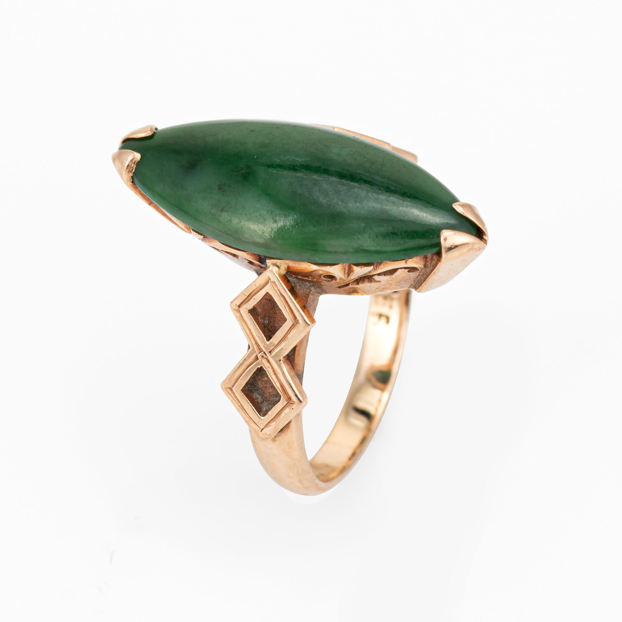 Stylish vintage jade navette style cocktail ring (circa 1960s) crafted in 14 karat yellow gold. 

Cabochon cut jade measures 19mm x 8mm (estimated at 6 carats). The jade is in very good condition and free of cracks or chips.  

The jade is perched
