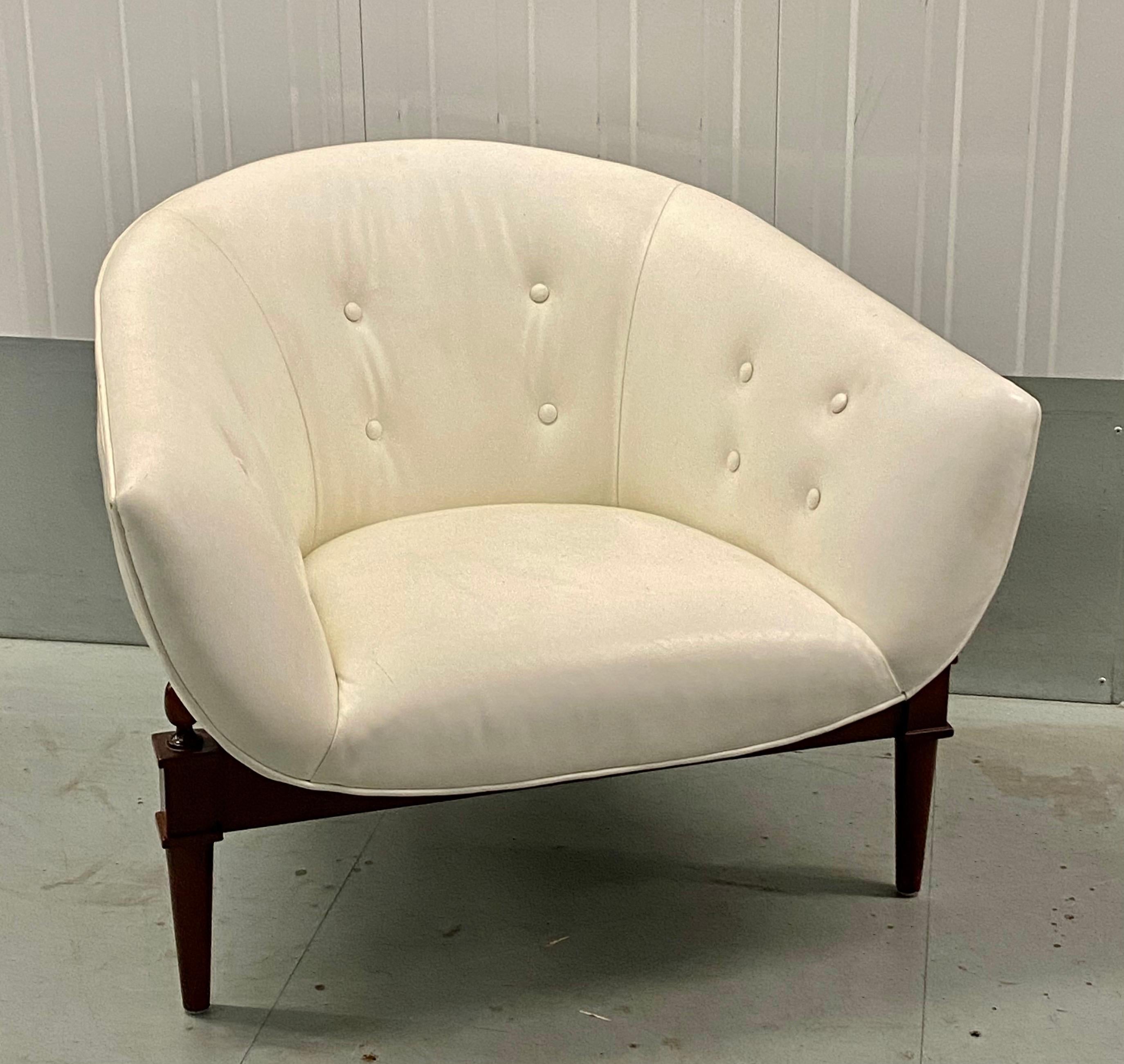 Global Views - 2367 - Mimi Chair - Reminiscent of the glamorous 1960's, the Global Views Mimi Chair marries modern design, exceptional craftsmanship, and very livable comfort. The barrel seat is covered in top grain cowhide leather, perched at a