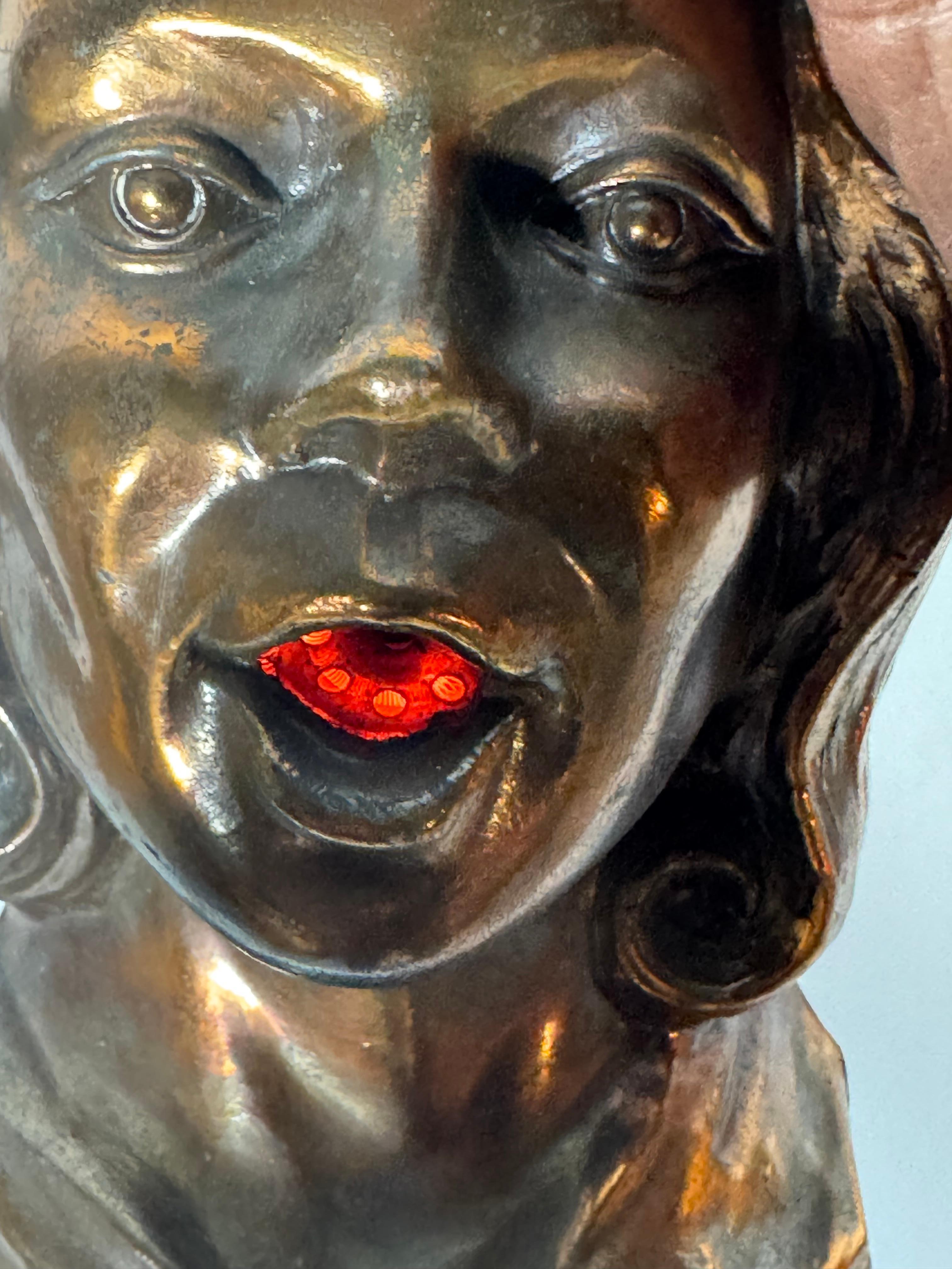Bronzed Stylized 1930s Art Deco Women's Head Electric Cigarette Lighter by Arturo Levi
