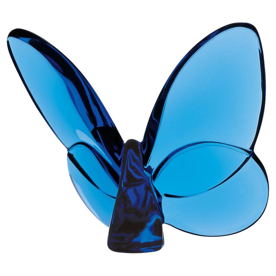 Gorgeous stylized blue crystal butterfly sculpture / paperweight by Baccarat, circa 1990s. The piece is in excellent condition with no visible imperfections and has great clarity. Signed on the underside, the piece measures 3