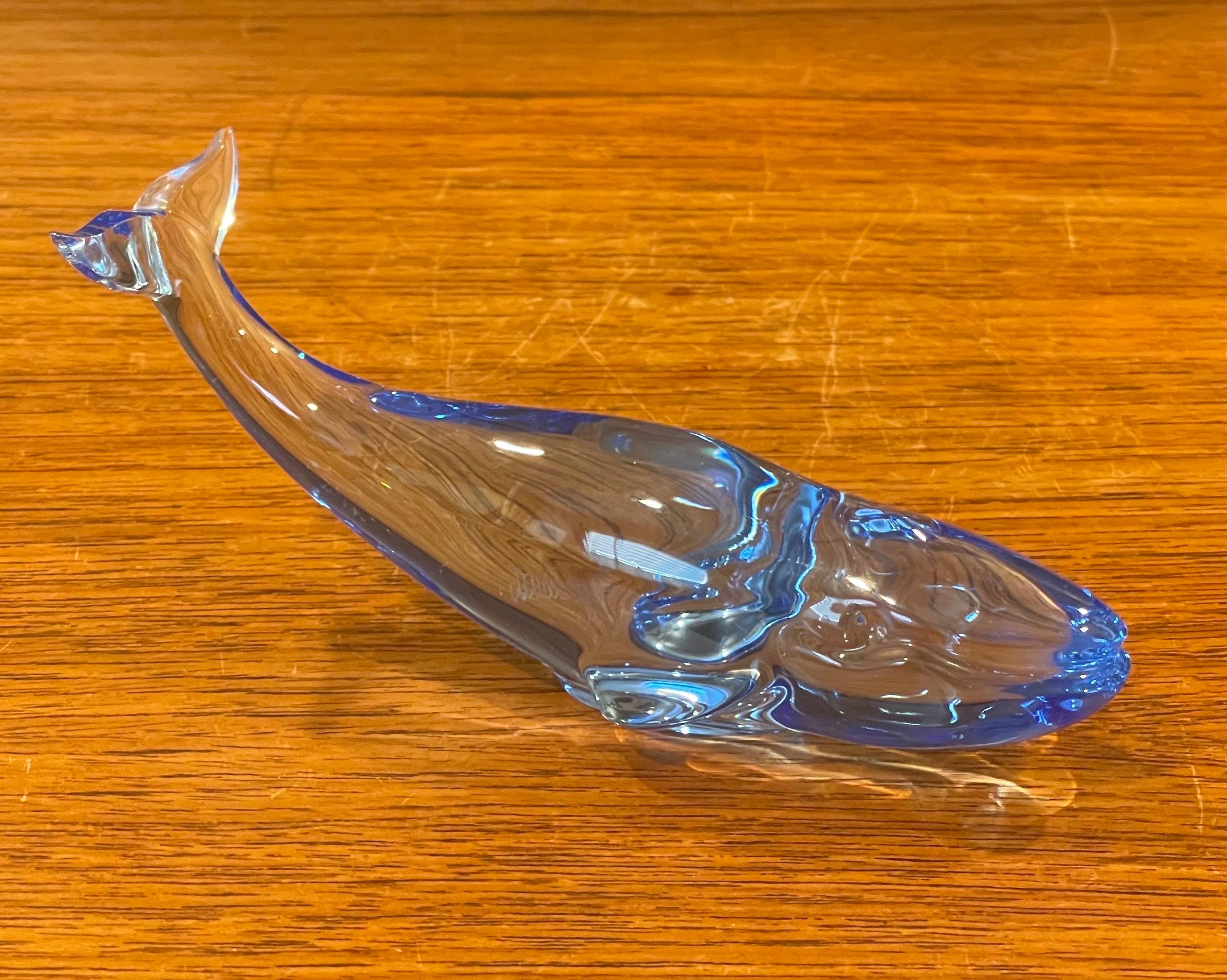 Gorgeous stylized blue crystal whale sculpture / paperweight by Baccarat, circa 1990s. The piece is in excellent condition with no visible imperfections and has great clarity. Signed on the underside, the piece measures 6