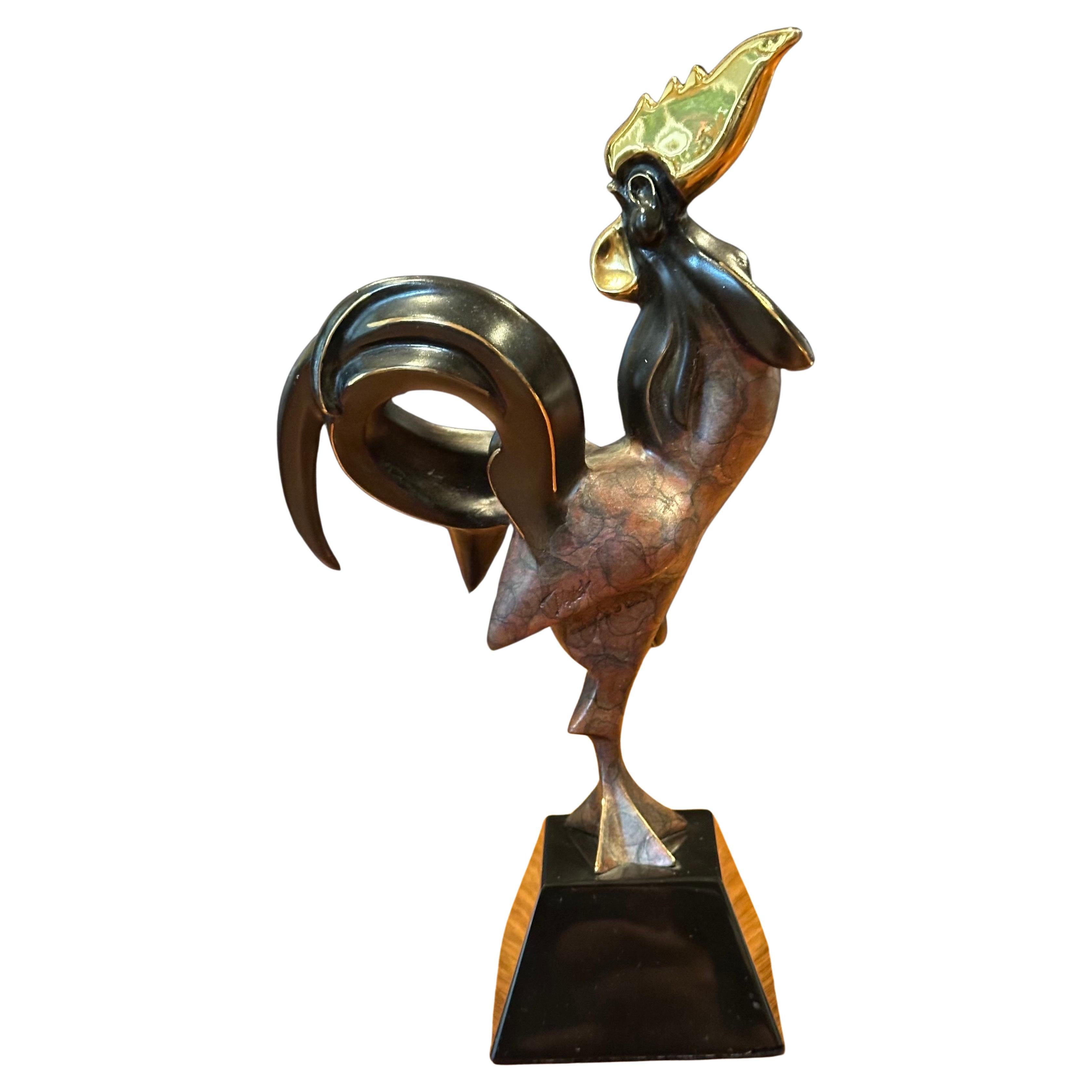Stylized bronze limited edition rooster sculpture by Alexsander Danel, circa 1996. The piece is in very good vintage condition, is signed on the base and numbered 376 / 1200. The overall measurements of the sculpture are 5.5