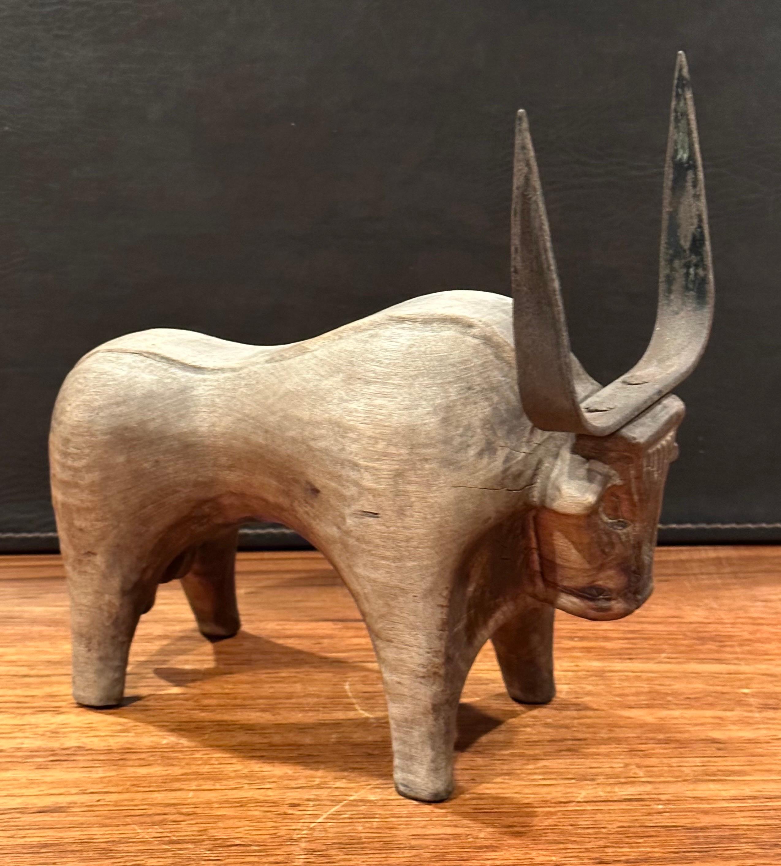 Stylized Carved Wood and Iron Charging Bull Sculpture  For Sale 1