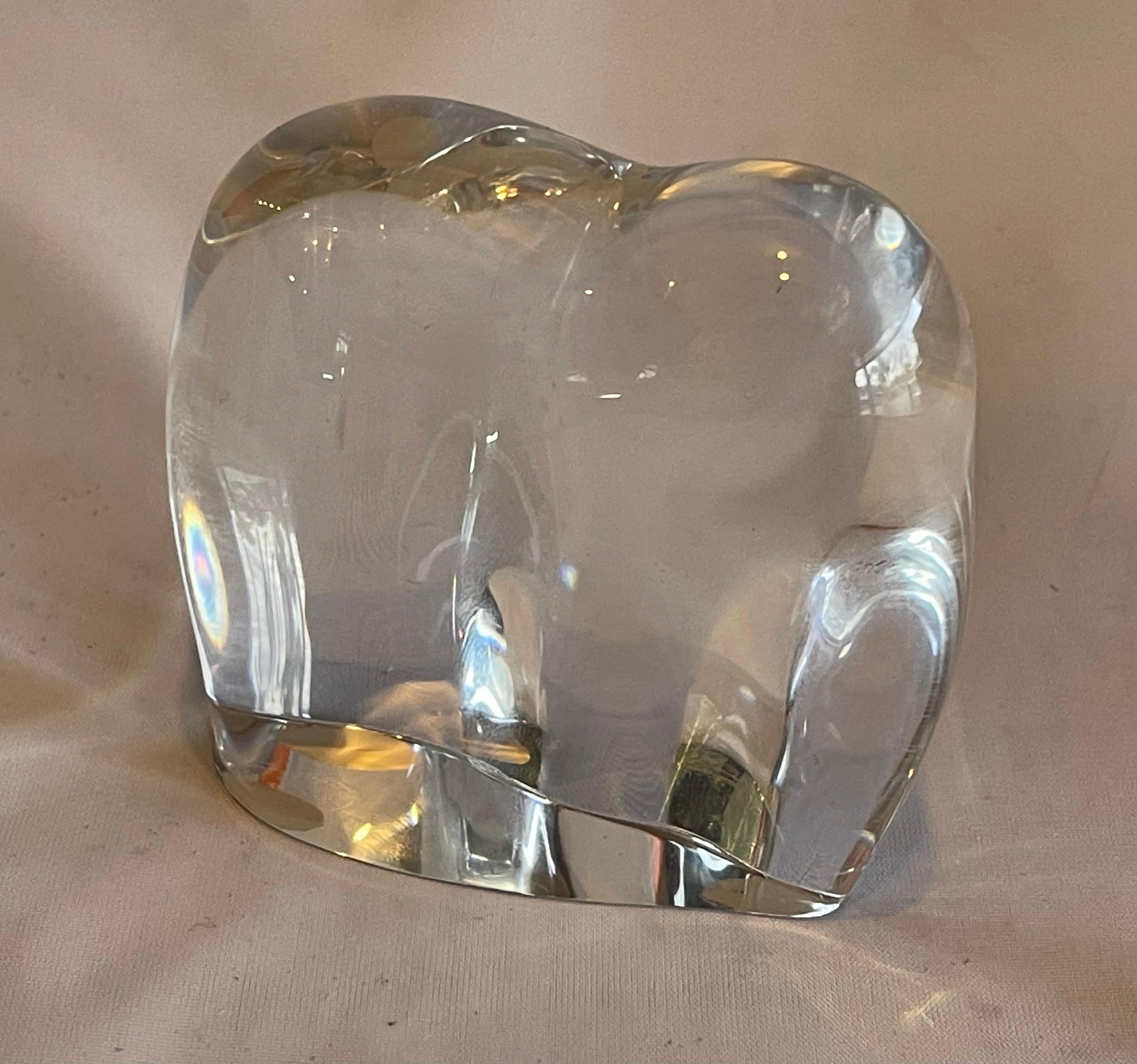 Gorgeous stylized crystal elephant sculpture by Baccarat, circa 1990s. The piece is in excellent condition with no visible imperfections and has great clarity. Signed on the underside, the piece measures 2.625