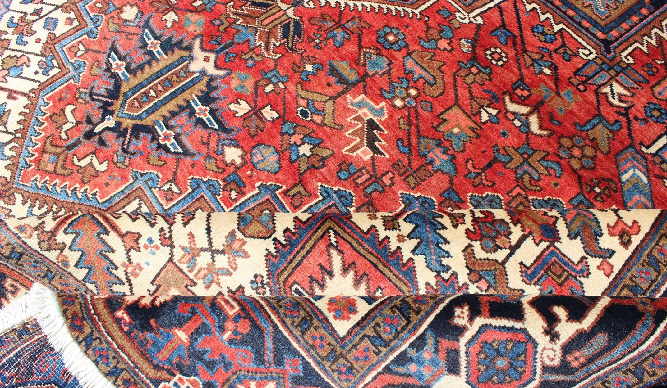 Semi Antique Persian Heriz Rug with Center Medallion Design in Rust Red and Blue In Excellent Condition In Atlanta, GA