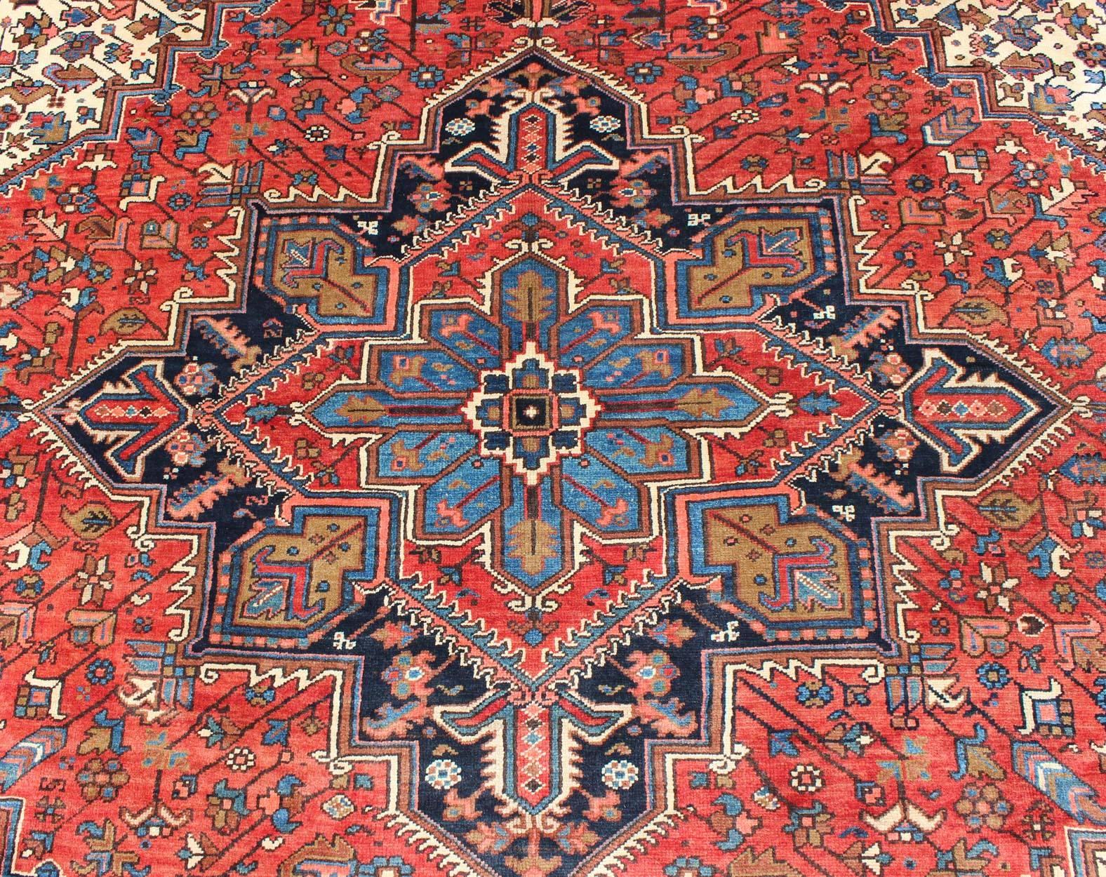 Mid-20th Century Semi Antique Persian Heriz Rug with Center Medallion Design in Rust Red and Blue