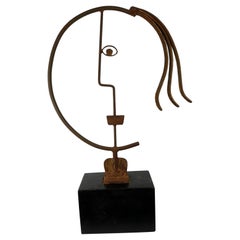 Stylized Modernist Head of Steel on a Wooden Base