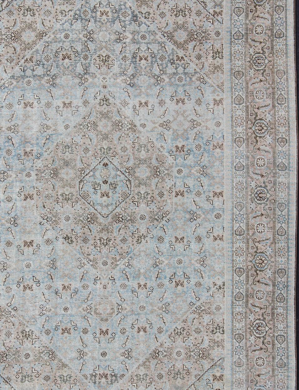Light Blue and Taupe Diamond Medallion Geometric Design Tabriz Rug from Persia, Keivan Woven Arts / rug SUS-1908-23, country of origin / type: Iran / Tabriz, circa 1920

This antique Tabriz carpet from 1920s Persia features a central field hosting a